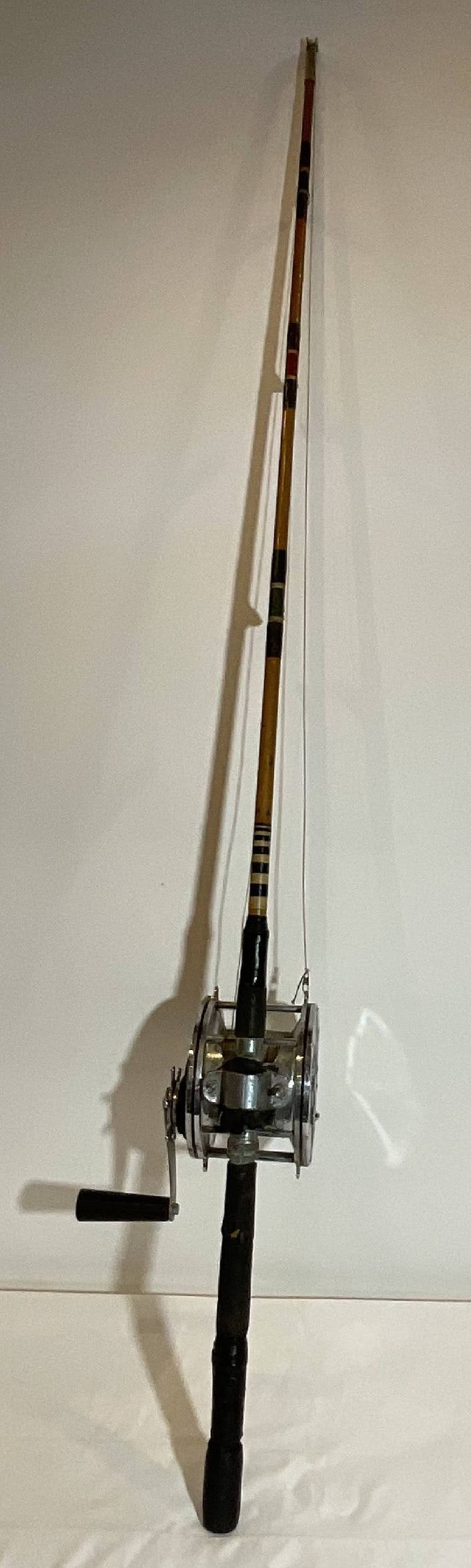 Tuna Fishing Rod with Giant Penn Senator 14/0 Reel: Penn Senator 14/0 Big Game fishing reel mounted to a rod with strong wood pole. This is a classic big game fishing pole, ready to fish or use as d?cor. Nice piece of fishing gear. 14 lbs. 68"W.
