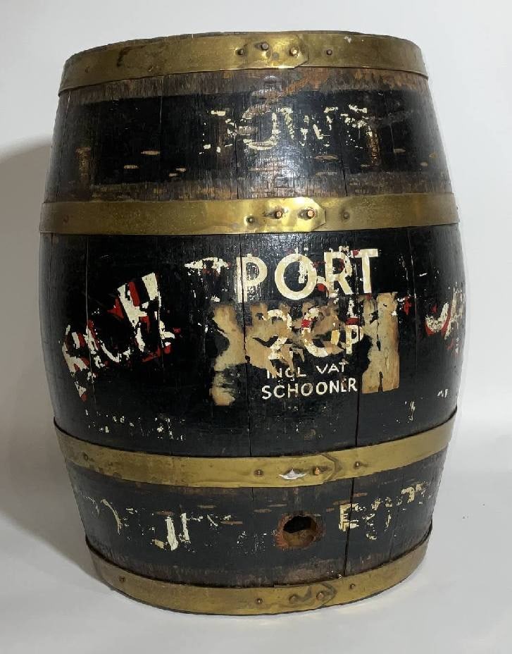 Brass Bound Port Wine Keg: Brass Bound Port wine keg. Old port wine keg from a pub with brass bands, bung hole, and wood spigot. Remnants of "Schooner Port", as well as price of 20p with V.A.T. painted but distressed. Great ant