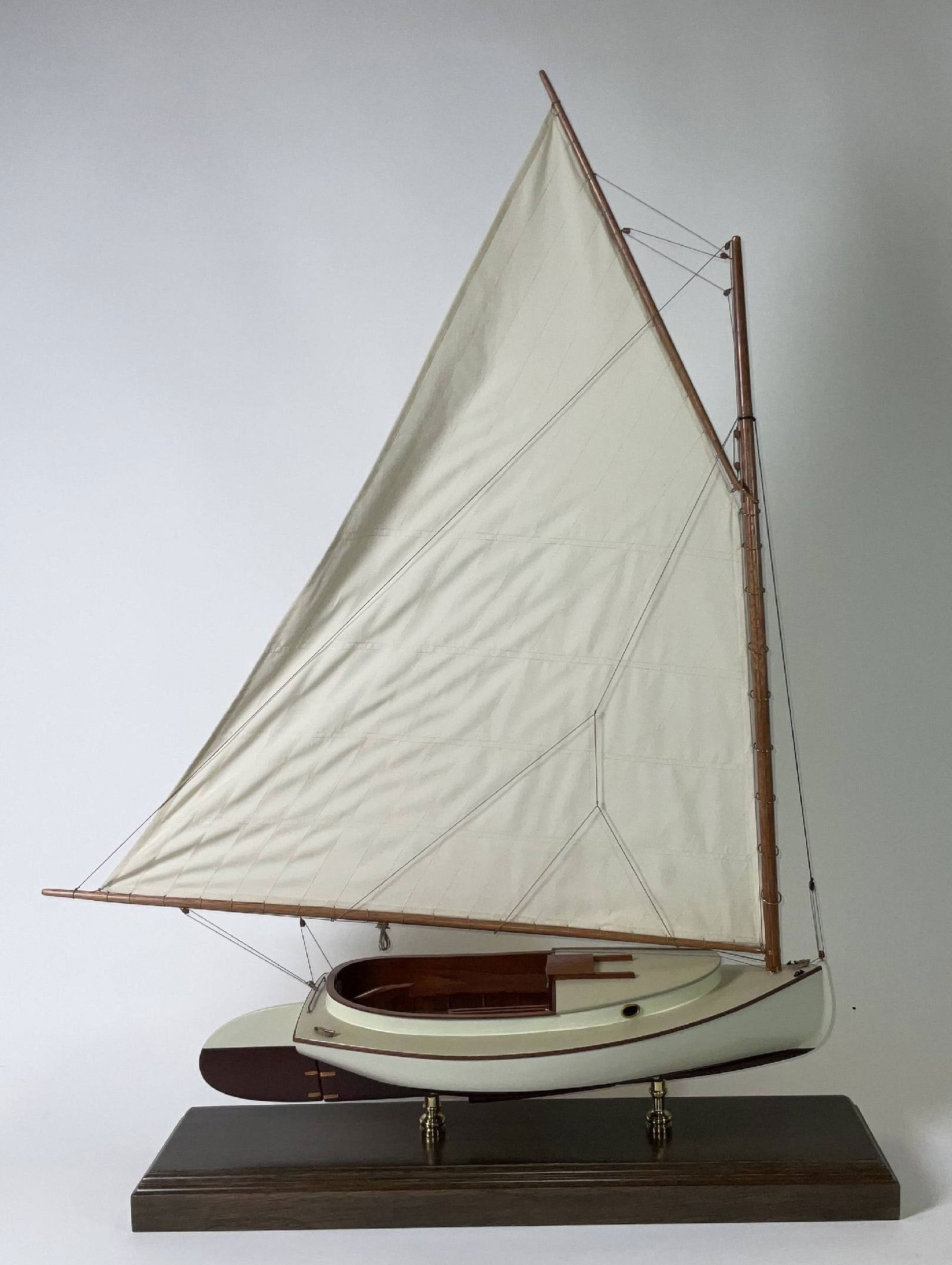 Cape Cod Catboat Model: Scale model of a Crosby Catboat. Crosby Catboat were built in Osterville on Cape Cod. Mounted on brass pedestals to a mahogany base. Rigged with a linen sail. cockpit with bench and tiller. Fine model
