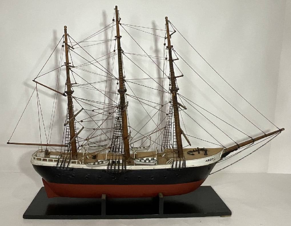 Antique Model of the Sailing Barque Argo: Antique model of the barque Argo with much detail. Vessel has cabins with windows, hatches, capstans, helm, cleats, and ladders. Four lifeboats hang from davits. The model is rigged with standing and