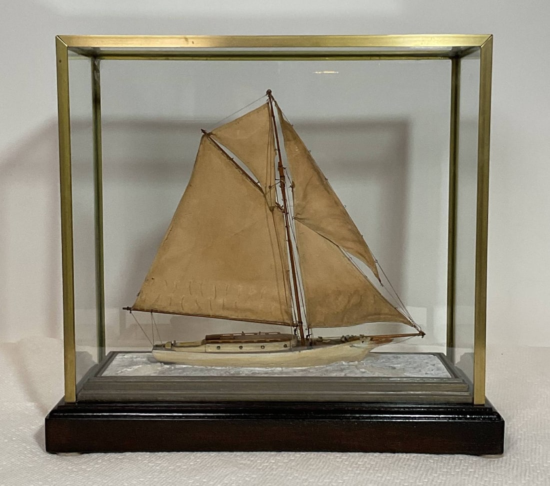 Ship Model that was a Feature Prop in Equalizer 2 Film: Antique model of the sloop Lavinia set at its waterline onto a simulated sea. The model was a prop in the movie Equalizer 2 with Denzel Washington. The director, Antoine Fuqua, shot a scene looking ri