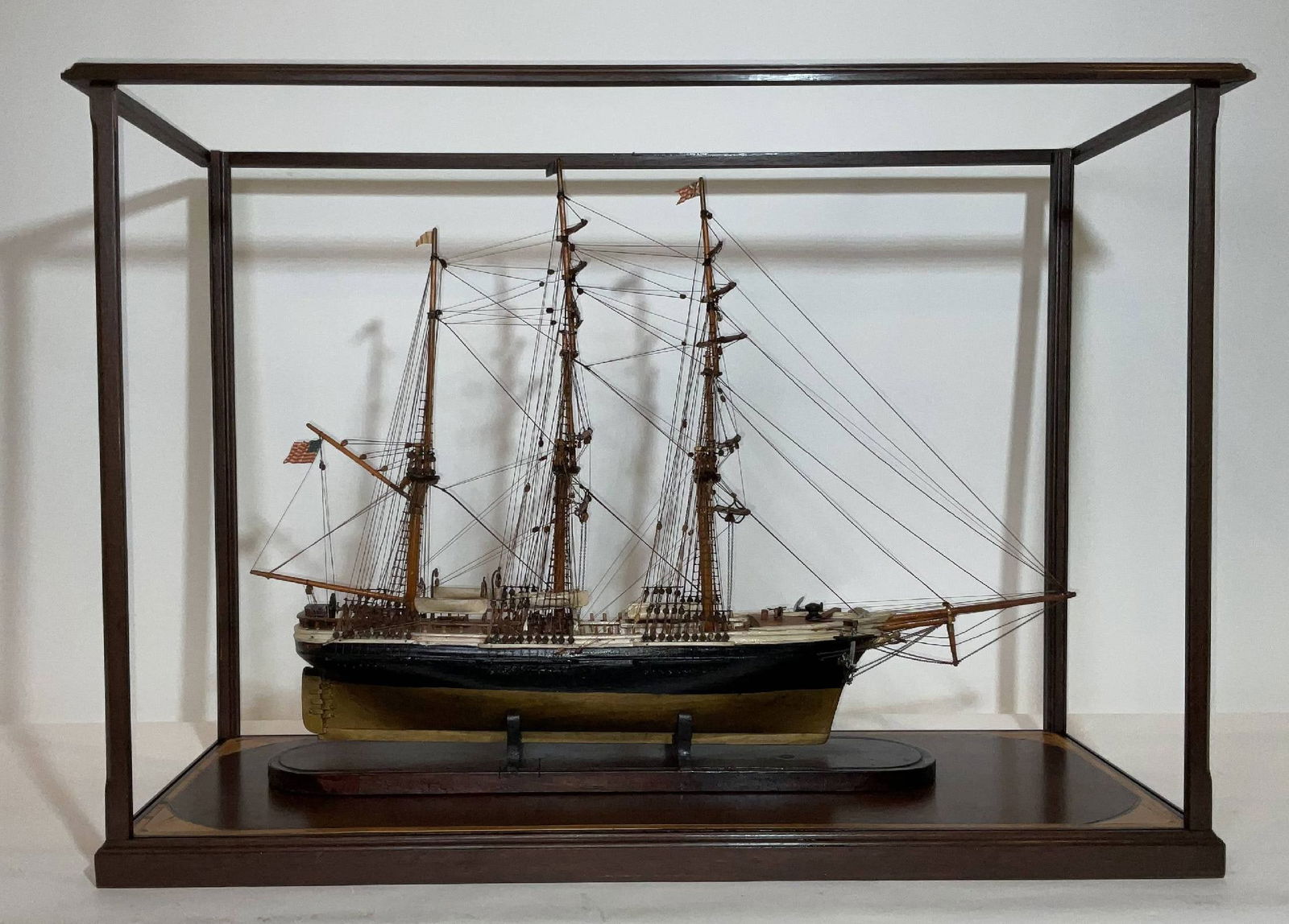 Antique Ship Model of an American Bark Ship in Display Case: Detailed ship model in a display case. Fine model of an American bark. A mermaid figurehead with horn is at the bow. Fully rigged with standing and running cords, ratlines with deadeyes, and appropria