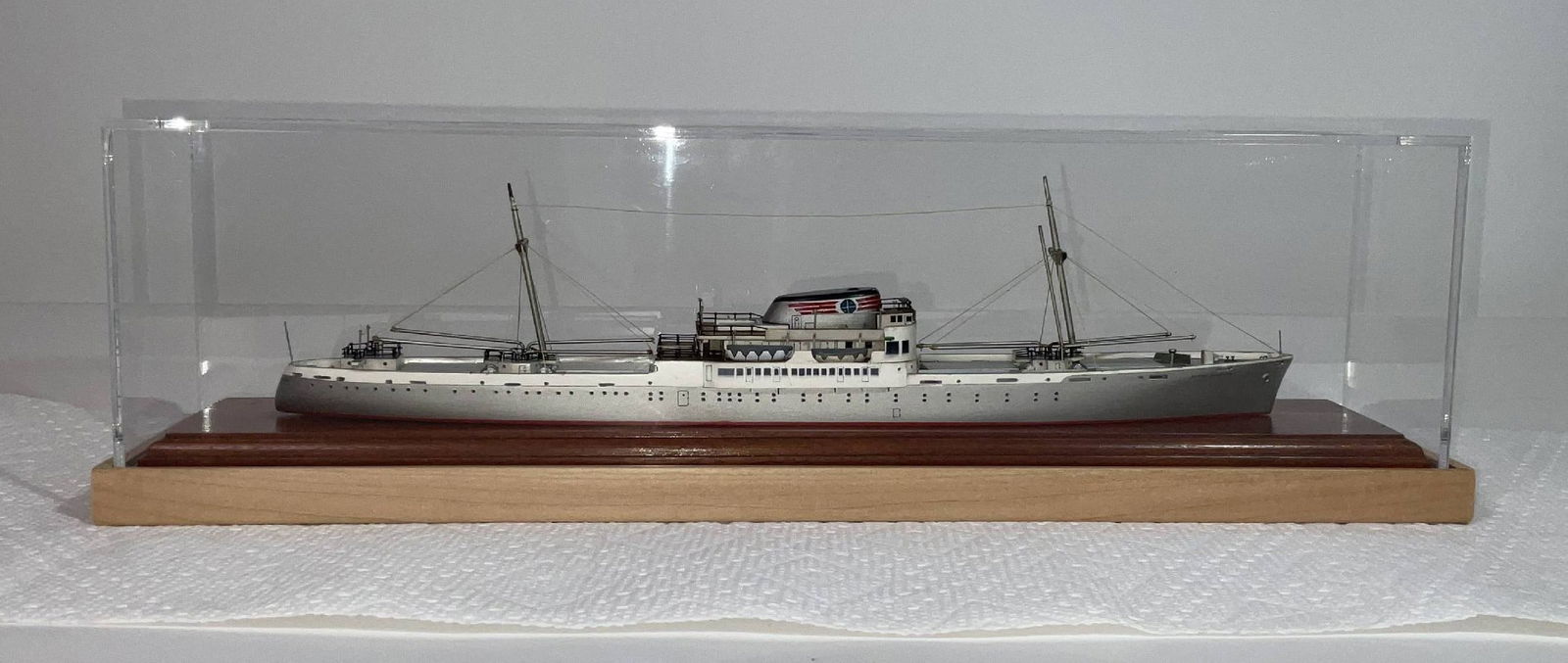 A cased 14" Van Ryper model of the Alcoa Courier: A cased 14" waterline model of the Alcoa Courier, fully rigged with extensive deck gear at appx. 1" = 385'. Alcoa Courier's keel was laid in 1941 by the Moore Dry Dock Co. When completed, she was requ