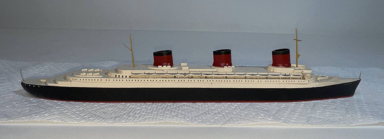 A large scale Van Ryper version of the Normandie.: This model is 16" long and was formerly in the collection of F.W. Woolworth CEO Byron Dewitt Miller. These larger scale versions of Van Ryper's artistry are increasingly hard to come by, as they are f