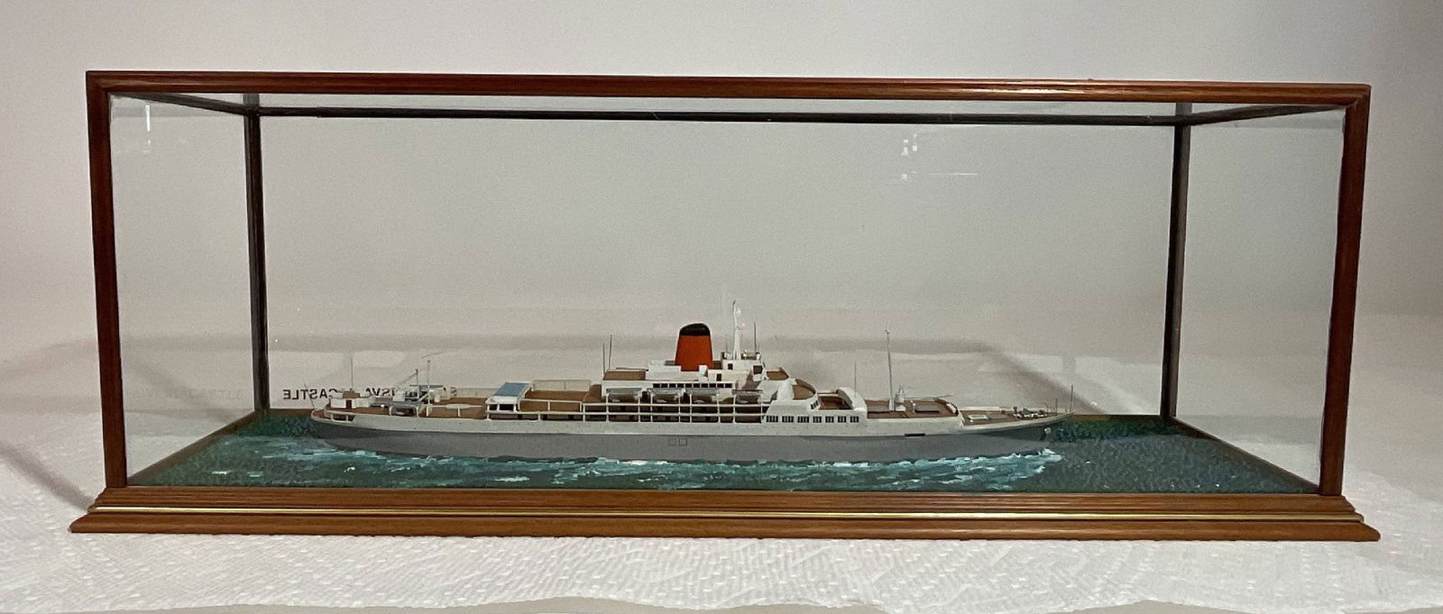 A cased waterline model of the SS Transvaal Castle by Ron Hughes: A cased waterline model of the SS Transvaal Castle by the renowned modeler Ron Hughes from Great Britain. The Transvaal Castle was launched in 1961 by the Union Castle Line for mail service between So
