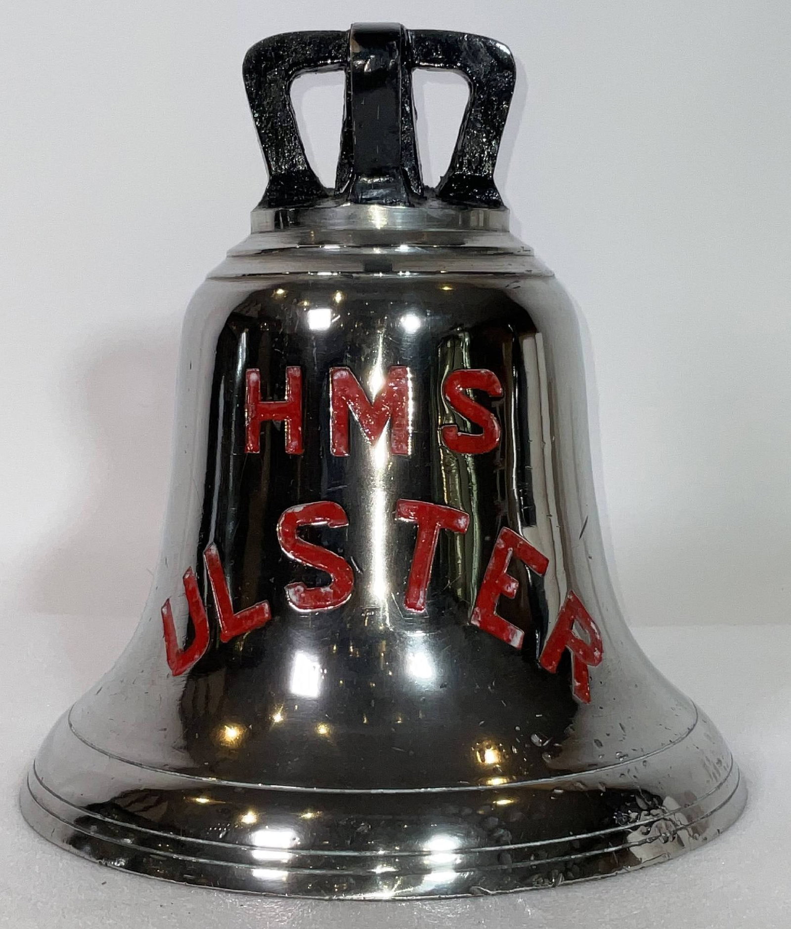 Royal Navy Destroyer HMS Ulster Ship's Bell: Ship's bell from the Kamikaze surviving destroyer HMS Ulster. 28 lbs. 11" H x 10 1/2" Diameter. HMS Ulster was a U-class destroyer of the Royal Navy, launched in 1942 and active during World War II. S