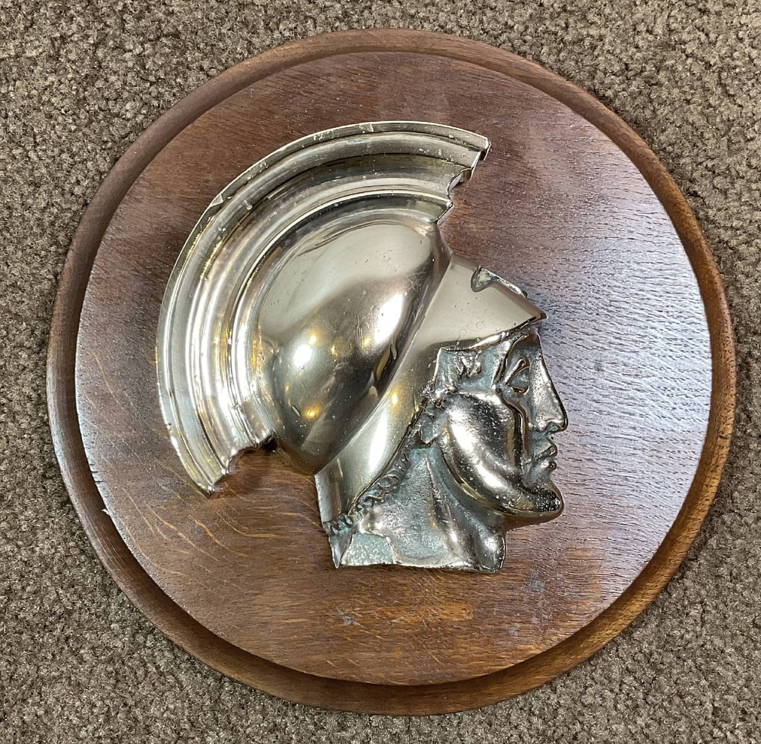 Gun Tampion of HMS Achilles: Royal Navy gun tampion from HMS Achilles cast in brass and mounted to a timber backboard. Highly polished. 9 lbs. 11" Diameter.