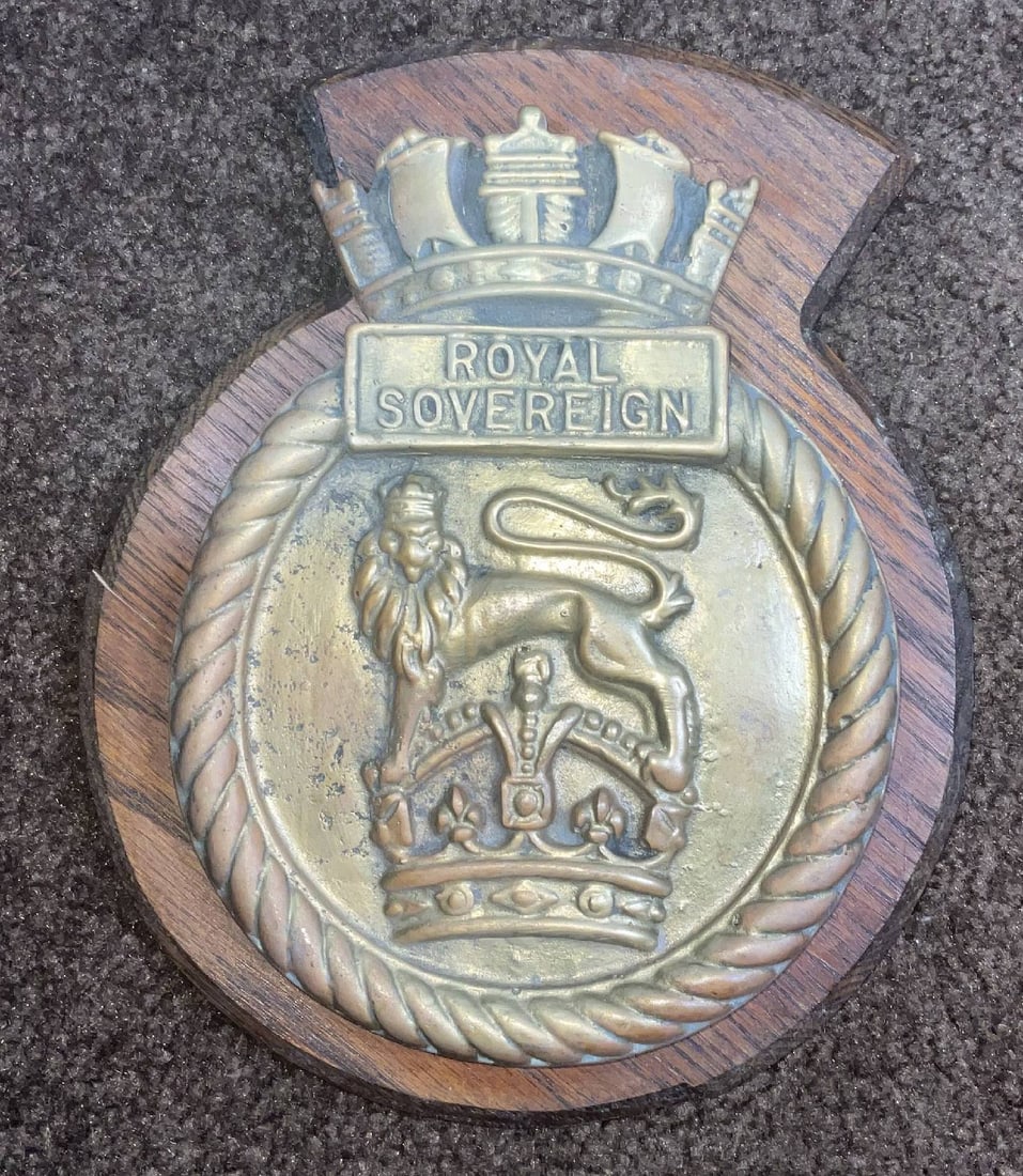 Royal Navy Gun Tampion from HMS Royal Sovereign: Brass gun tampion from the Royal Navy battleship HMS Royal Sovereign. This badge was approved in 1919. The Royal Sovereign was built in Portsmouth in 1915, lent to the Soviet Navy between 1944-1949 an