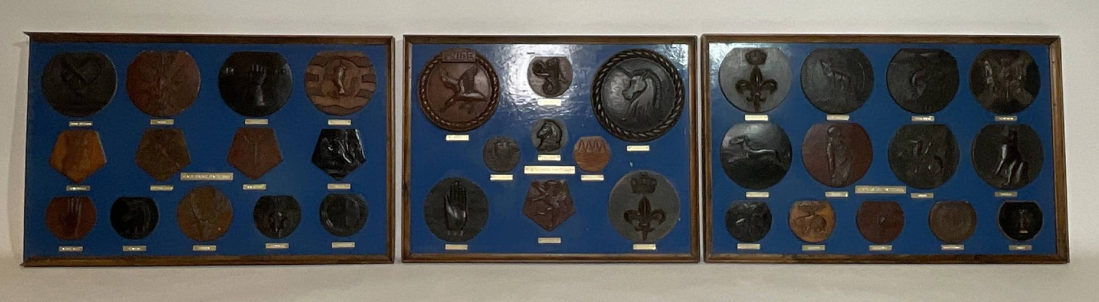 Royal Navy Badge Hand Carved Molds: Rare Royal Navy hand-carved casting molds for many naval ships. Ship's badges include HMS Loyalist, HMS Newfoundland, HMS Scotsman, HMS Chaser, HMS Drake, HMS Ulster, HMS Swiftsure, HMS Royalist, HMS 