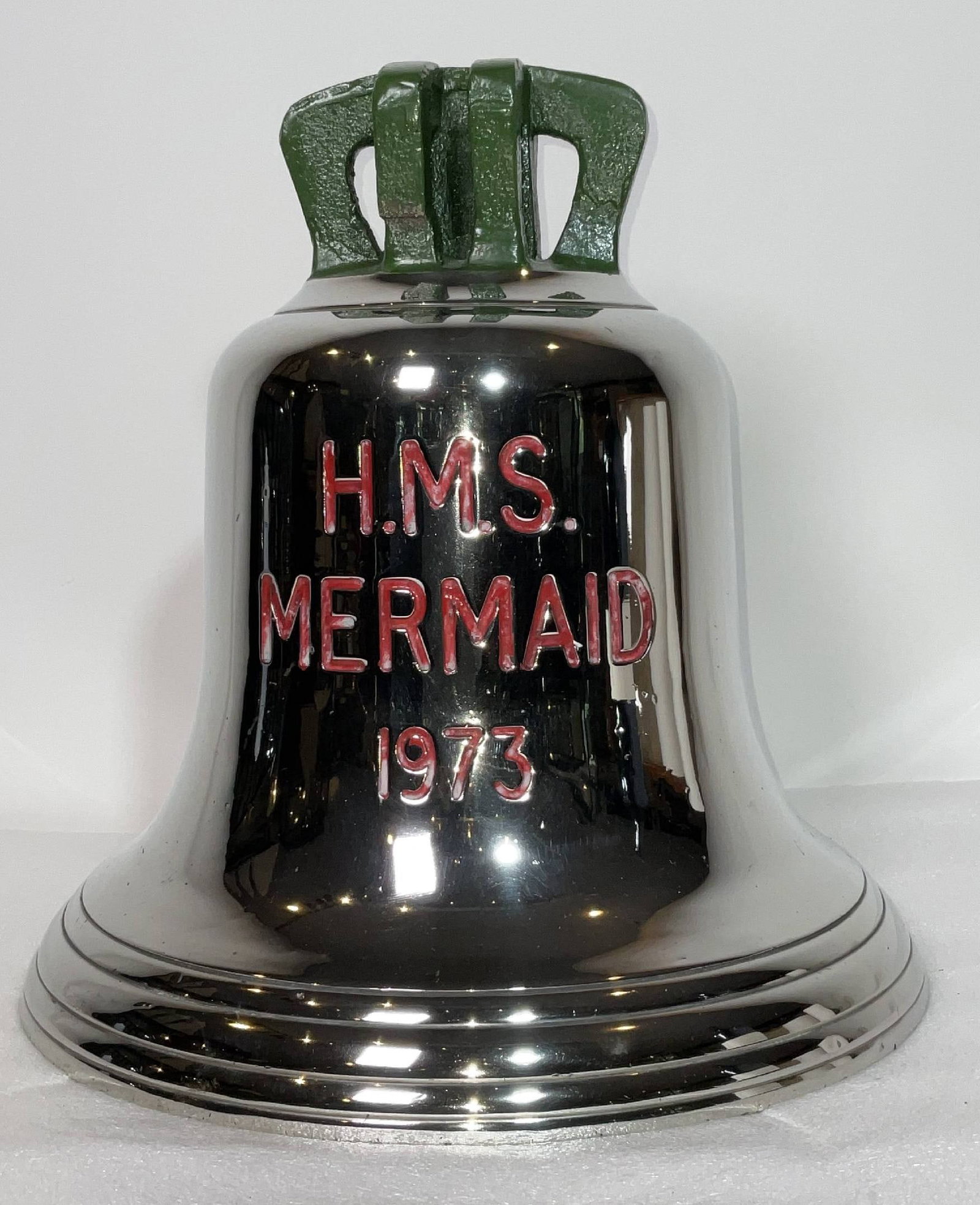 HMS Mermaid Ship's Bell from the 1973 Royal Navy Swan Class Sloop: Engraved bell from HMS Mermaid of 1973 with six canon crown bracket and three sound bows. Chrome over bell metal finish. Fitted with clapper and rope. HMS Mermaid was a modified Black Swan-class sloop