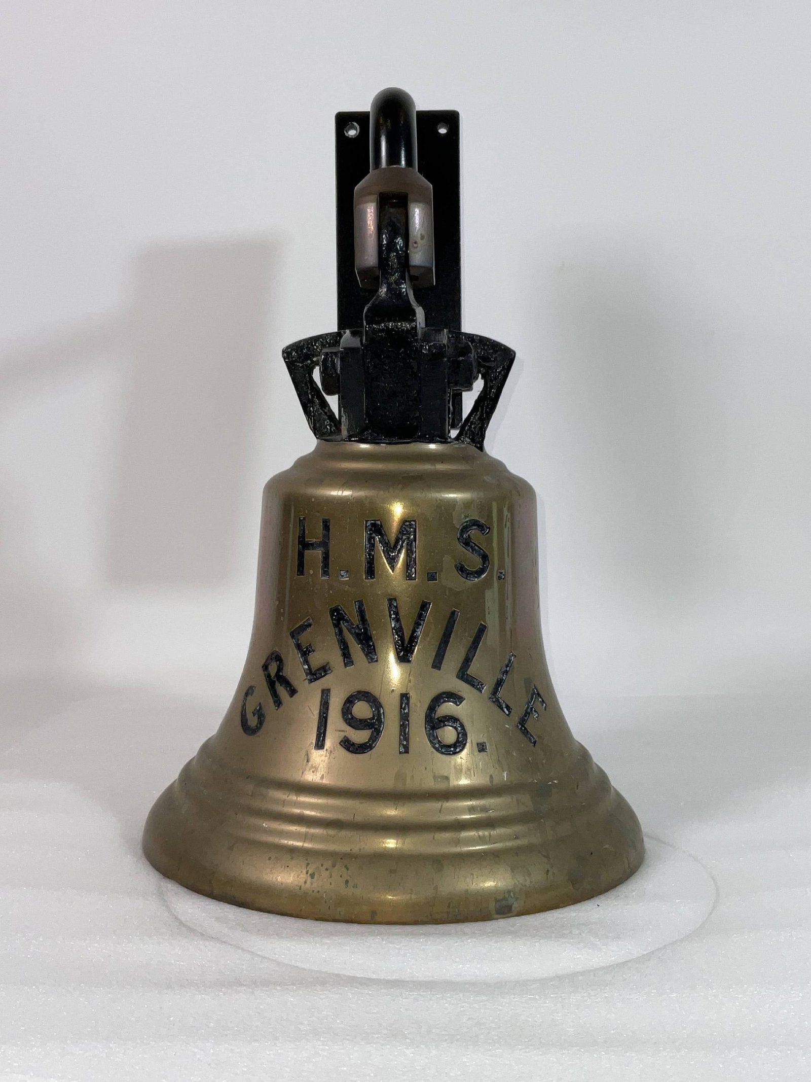 Ship's Bell from the Grand Fleet Royal Navy Destroyer HMS Greenville 1916: Royal Navy ship's bell deeply engraved "HMS Greenville 1916". With crown shaped top fitted to a wall mount bracket. Three sound bows. Fitted with clapper and rope. Through 1917, HMS Grenville served w