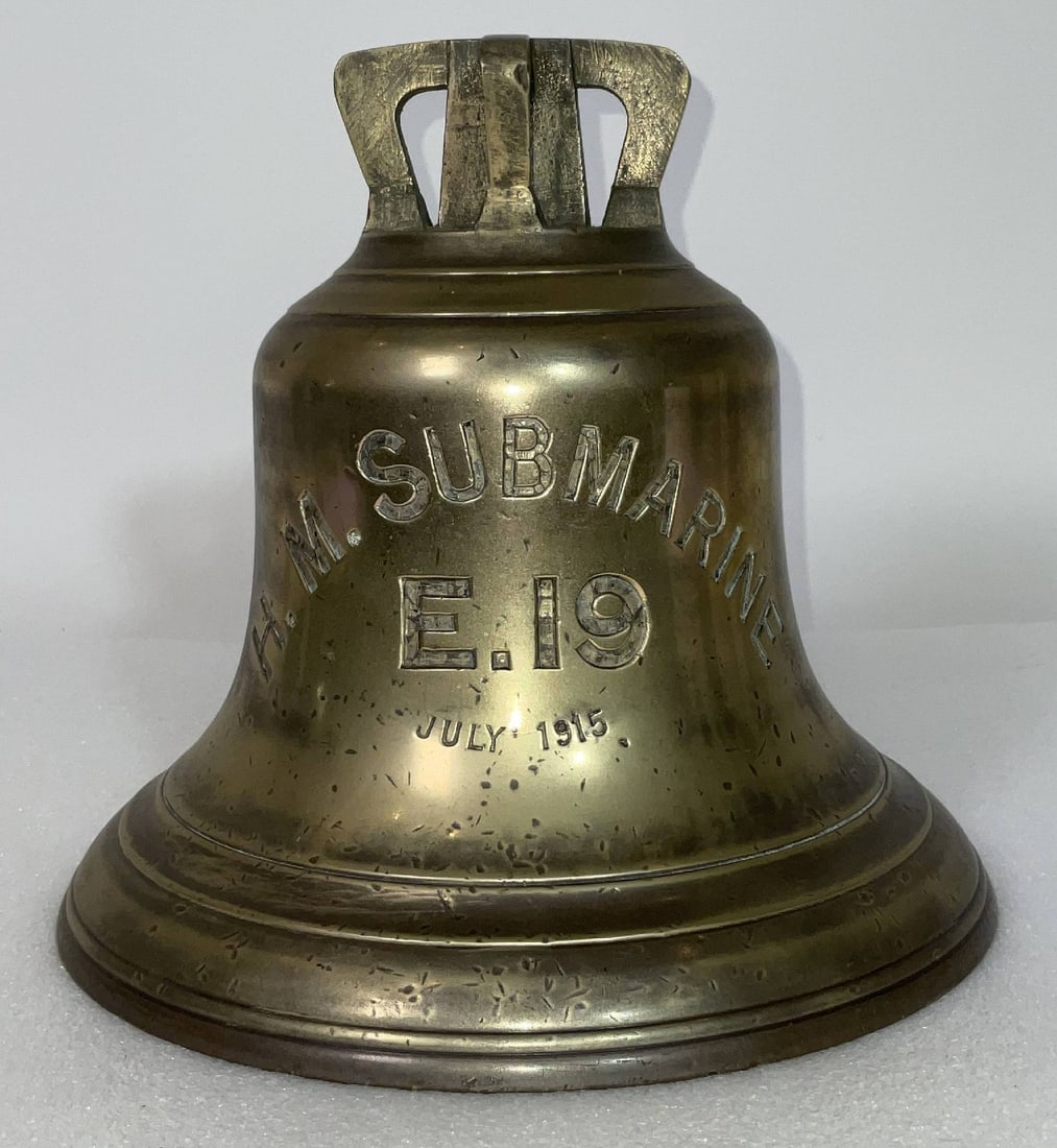 Bell from the British Royal Navy WWI Submarine HMS E19: World War I Royal Navy Submarine bell engraved HMS Submarine E19, July 1915. With a cast four canon crown. The government broad arrow is engraved into the backside. 13 lbs. 9" H x 9" Diameter.