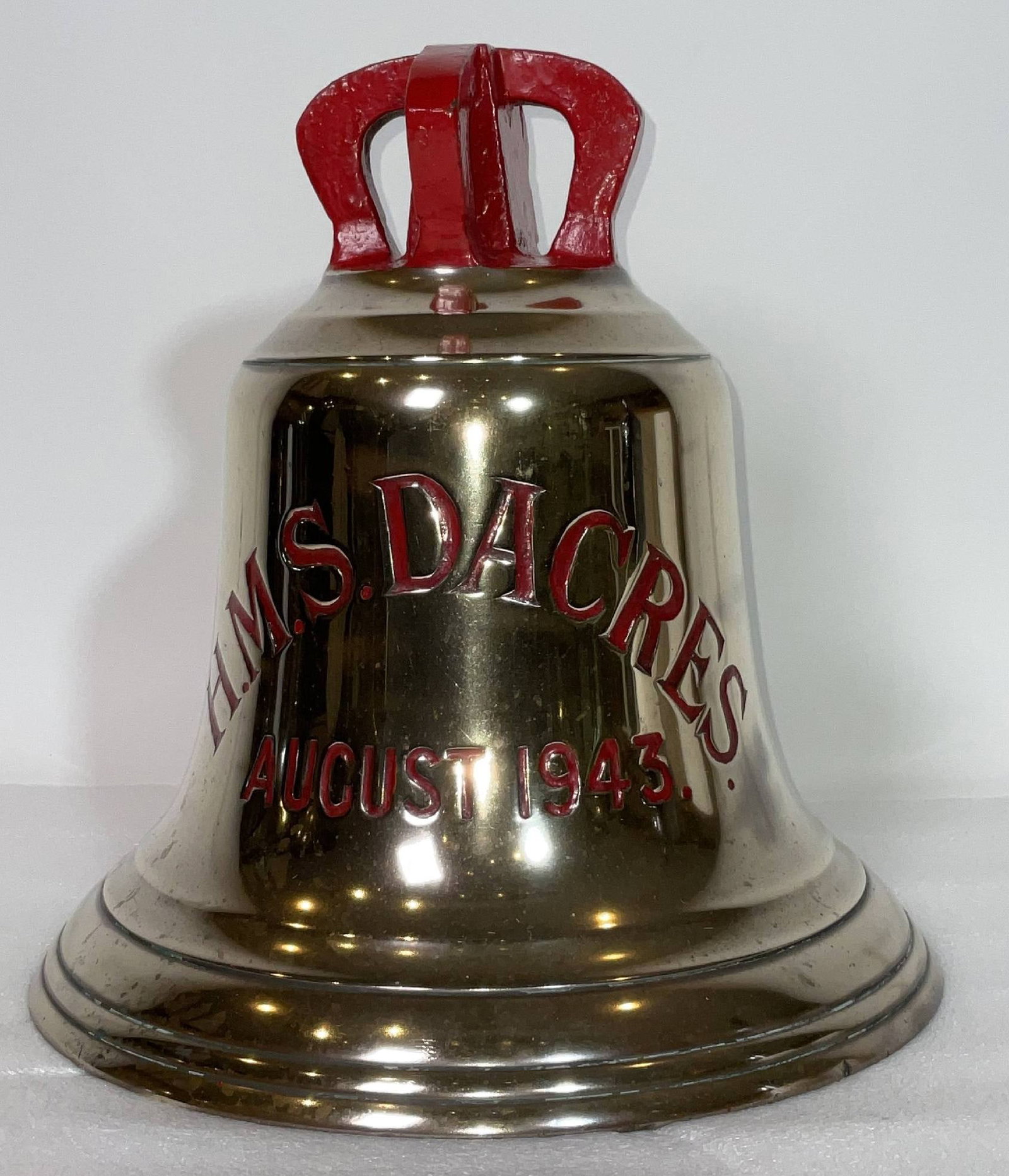 Ship's Bell from Royal Navy Frigate HMS Dacres 1943: British Royal Navy ship's bell with a four canon crown. HMS Dacres was a Captain-class frigate of the Royal Navy, originally built in the United States as part of the lend-lease program. She was launc