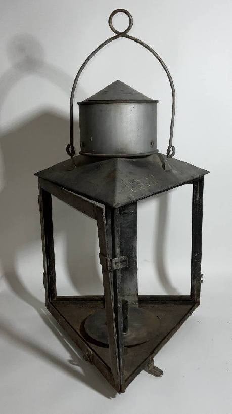 U.S. Coast Guard Post Lantern: USCG triangular post lighthouse service lantern. Used as a river or harbor navigational light. Three sides glass missing, hinged door with hasp. Quite rare, early twentieth century. 12 lbs.