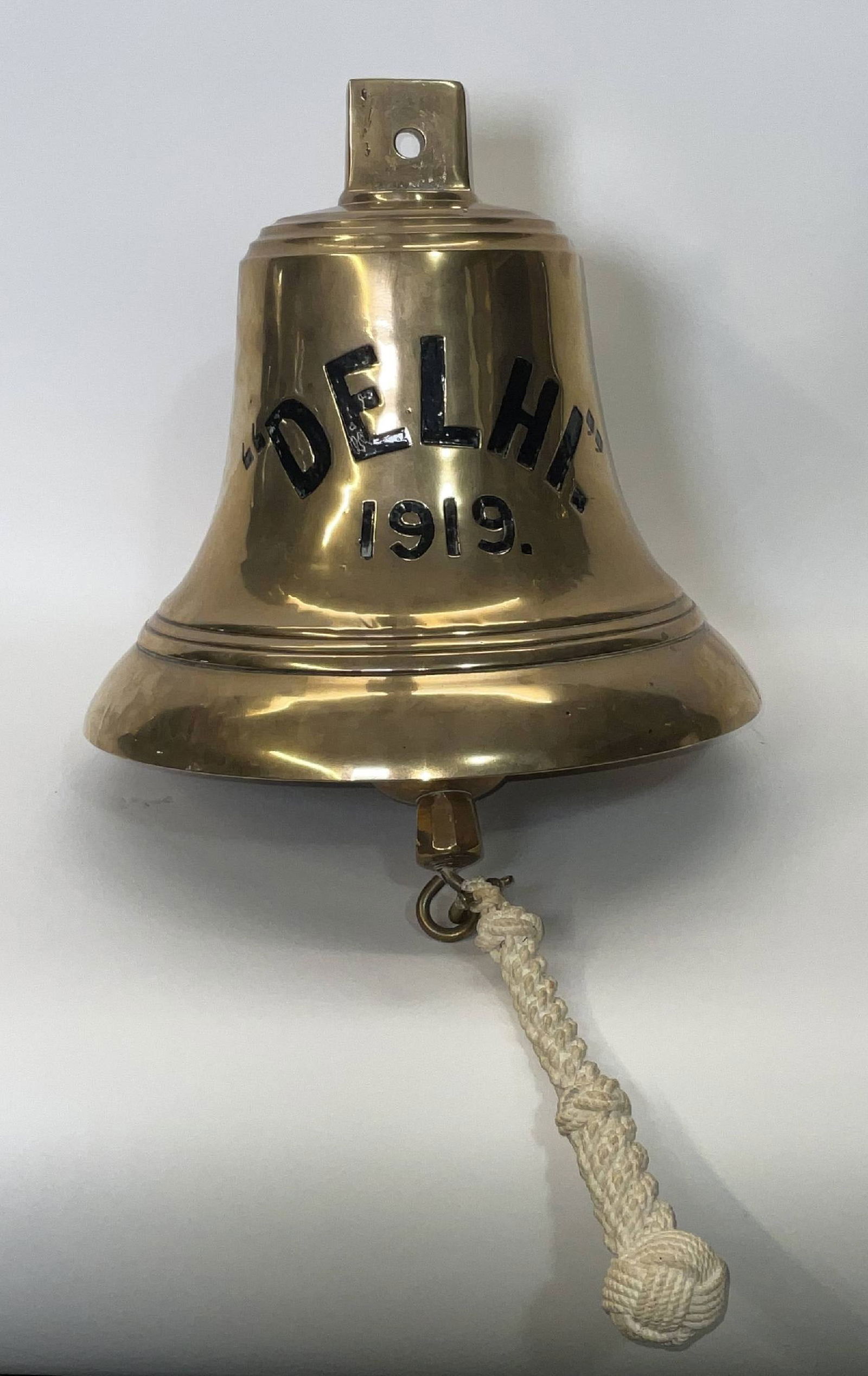 Bell from HMS Delhi, 1919.: Solid brass bell from the ship HMS Delhi, engraved “DEHLI” and dated 1919. HMS Delhi was a Danae-class light cruiser of the British Royal Navy, launched in 1918 and commissioned in 1919 at