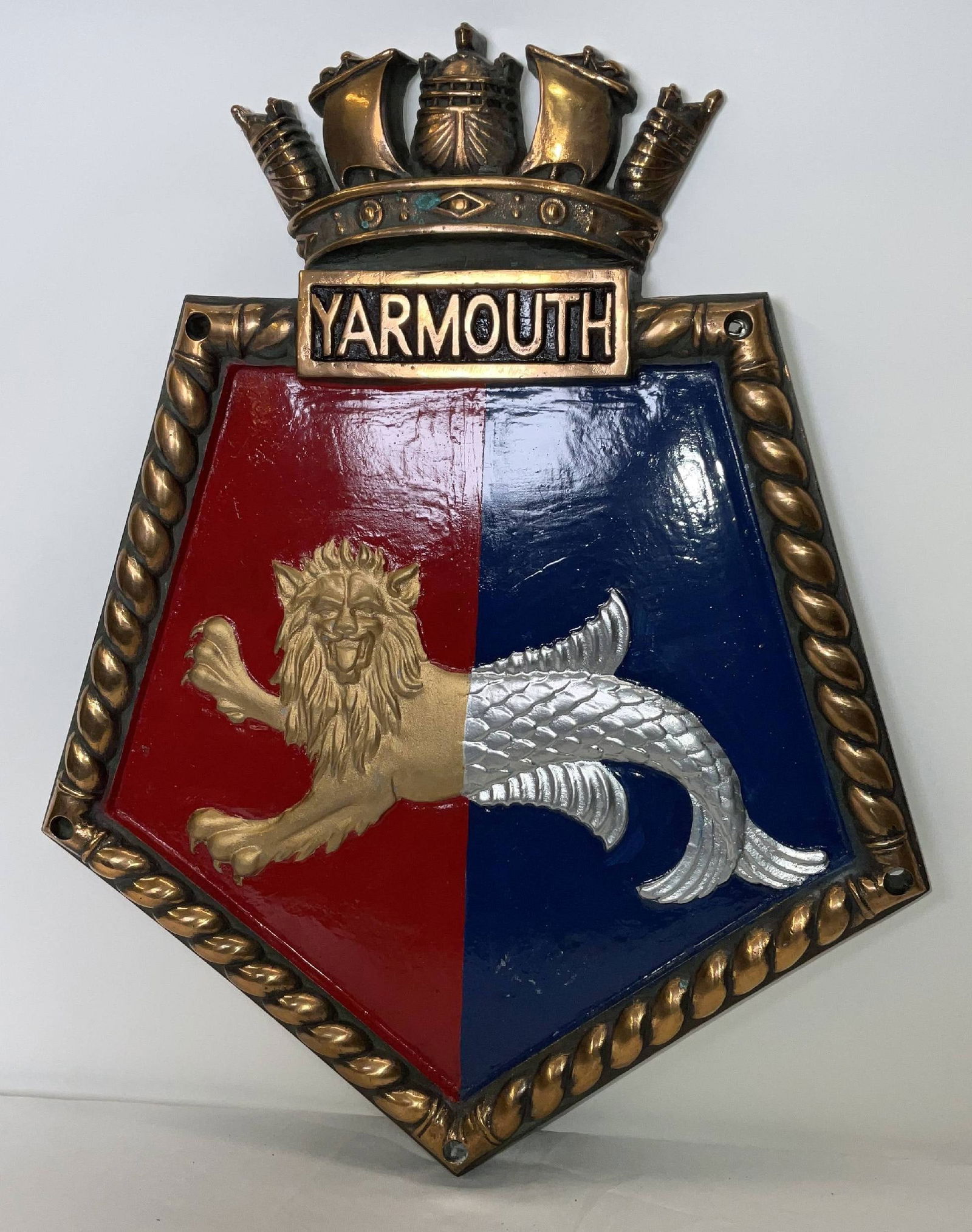 Chatham Pattern Screen Badge for HMS Yarmouth of 1911: Heavy British Royal Navy screen badge for HMS Yarmouth, a light cruiser launched in 1911. This massive twenty seven pound plaque has a polished border. This is a Chatham Pattern piece. 27 lbs. 21"H x
