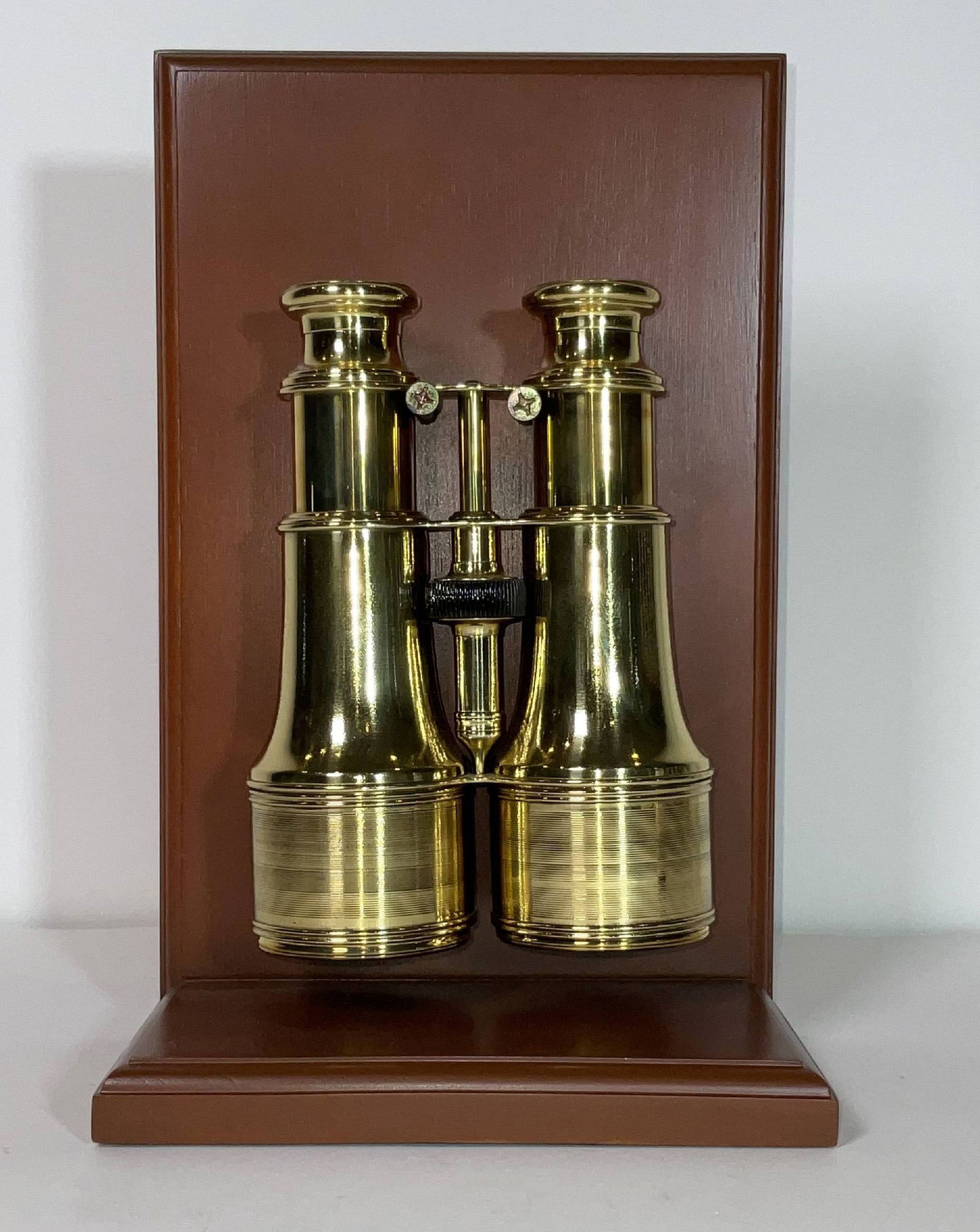 Yachting Binoculars on Stand by Lemaire Fab, Paris: Solid brass highly polished and lacquered yachting or library binoculars. With geared focal knob and sliding sunshades. 3 lbs. 12"H x 7"W x 5"D wood base. 7"H x 5"W x 2 1/2"D binocular.