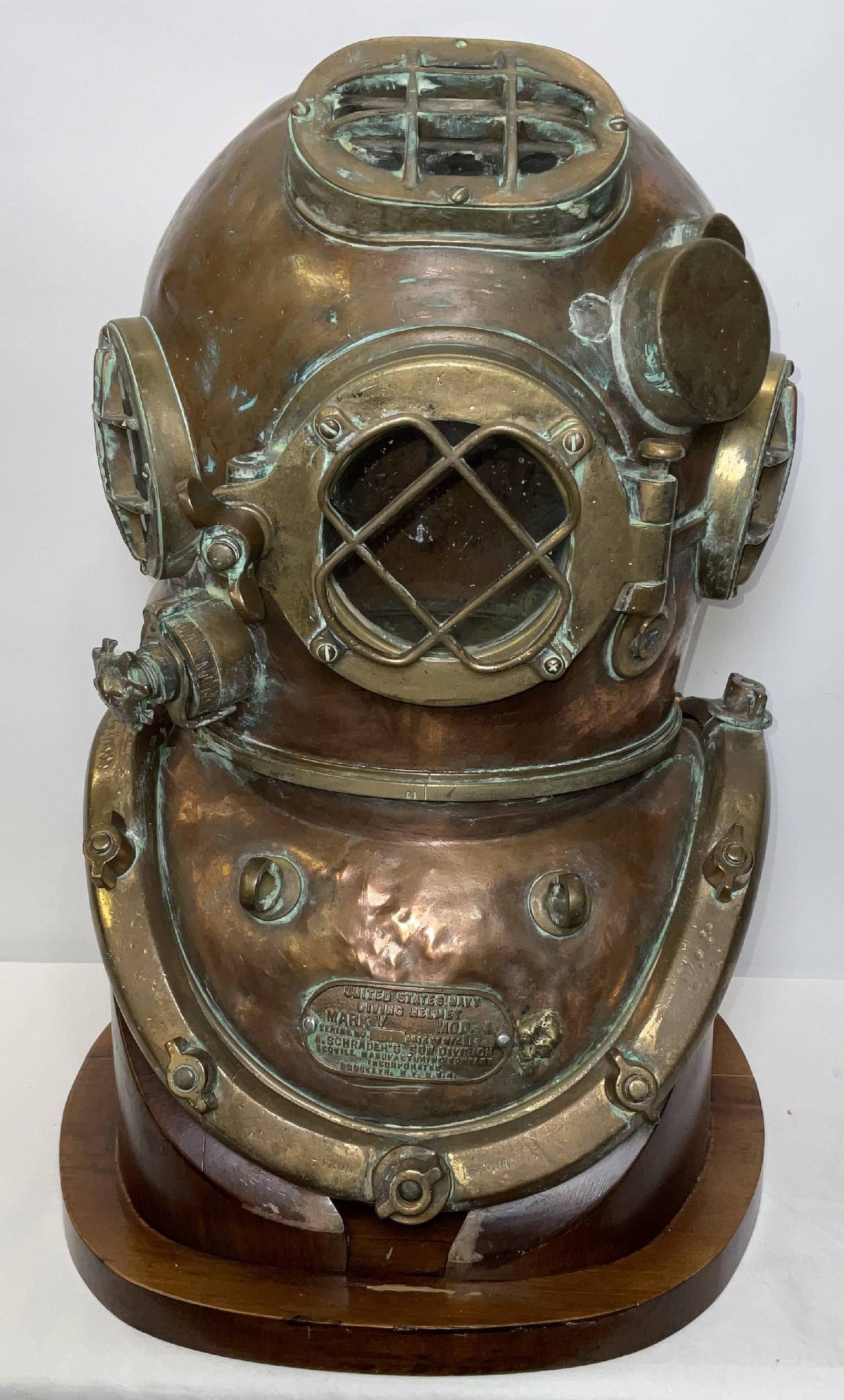 Mark V United States Navy Diving Helmet by Schraders: Original US Navy Mark V model. Diving helmet by a Schrader's Son Division, Scouill Manufacturing Company Incorporated. Brooklyn New York USA. Dated 1945. With bredpalte, bonnet and brailes. Four