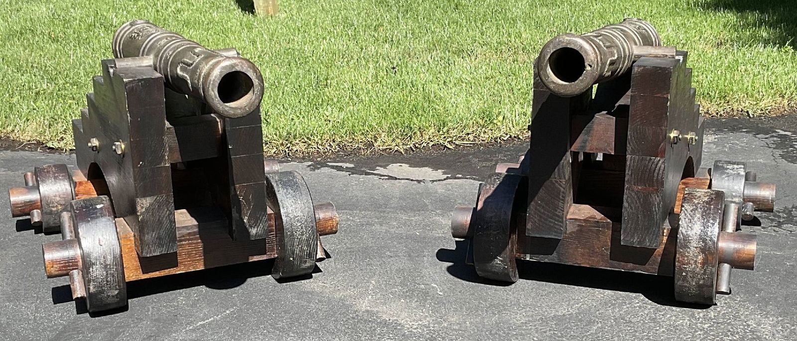 Pair of Bronze Spanish 1702 Replica Cannons on Carriages: Pair of bronze cannons on hardwood carriages. These are replicas of Spanish cannon dated 1702. Very high quality, outstandng display.