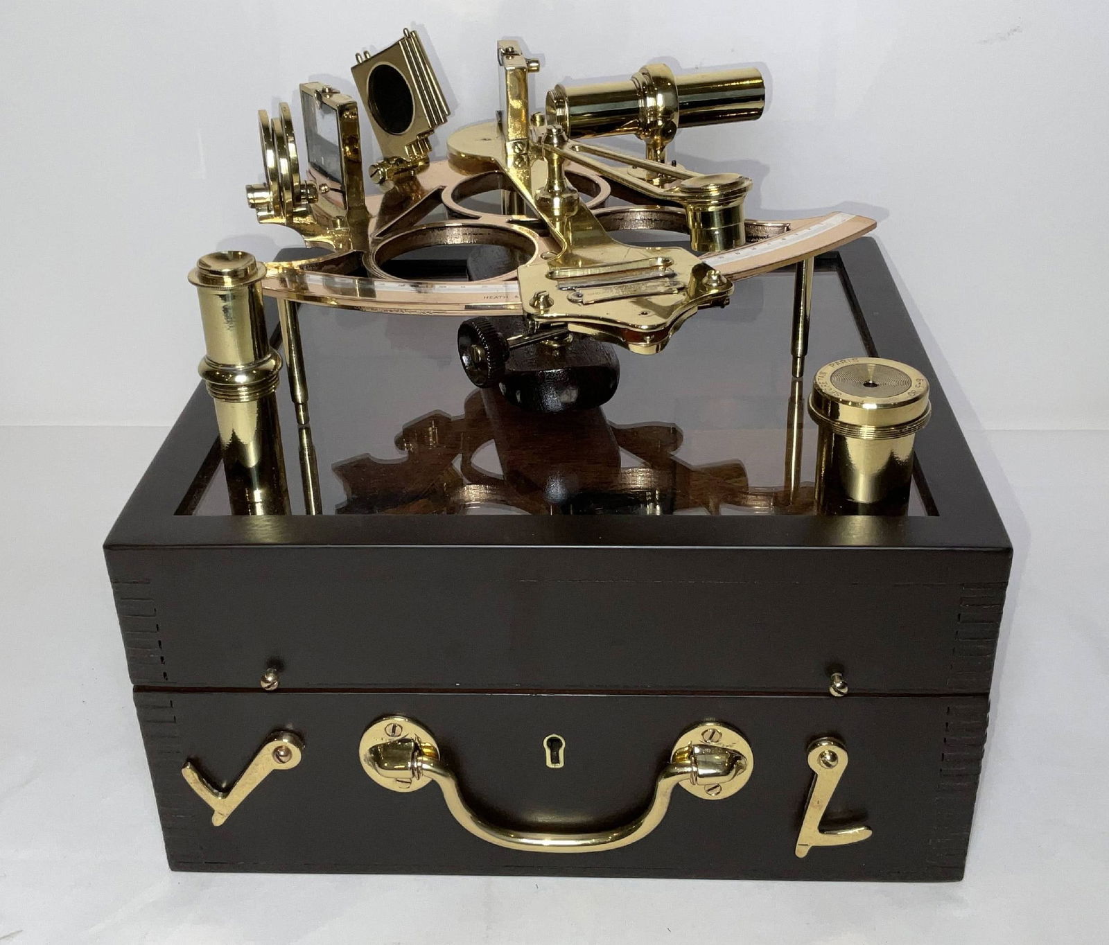 Antique Ship's Sextant in Glass Windowed Case: Meticulously polished and lacquered ship's sextant in a display case with window. The original box has its lid fitted with a glass panel creating an awesome display piece. The box has polished and lac