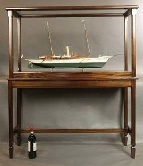 Steam Yacht "Erin": Exhibition quality model of Sir Thomas Lipton's private yacht, "Erin". Mahogany cabins, planked deck, six lifeboats, railings, skylights, funnels, etc. Mounted into a mahogany display case with table.