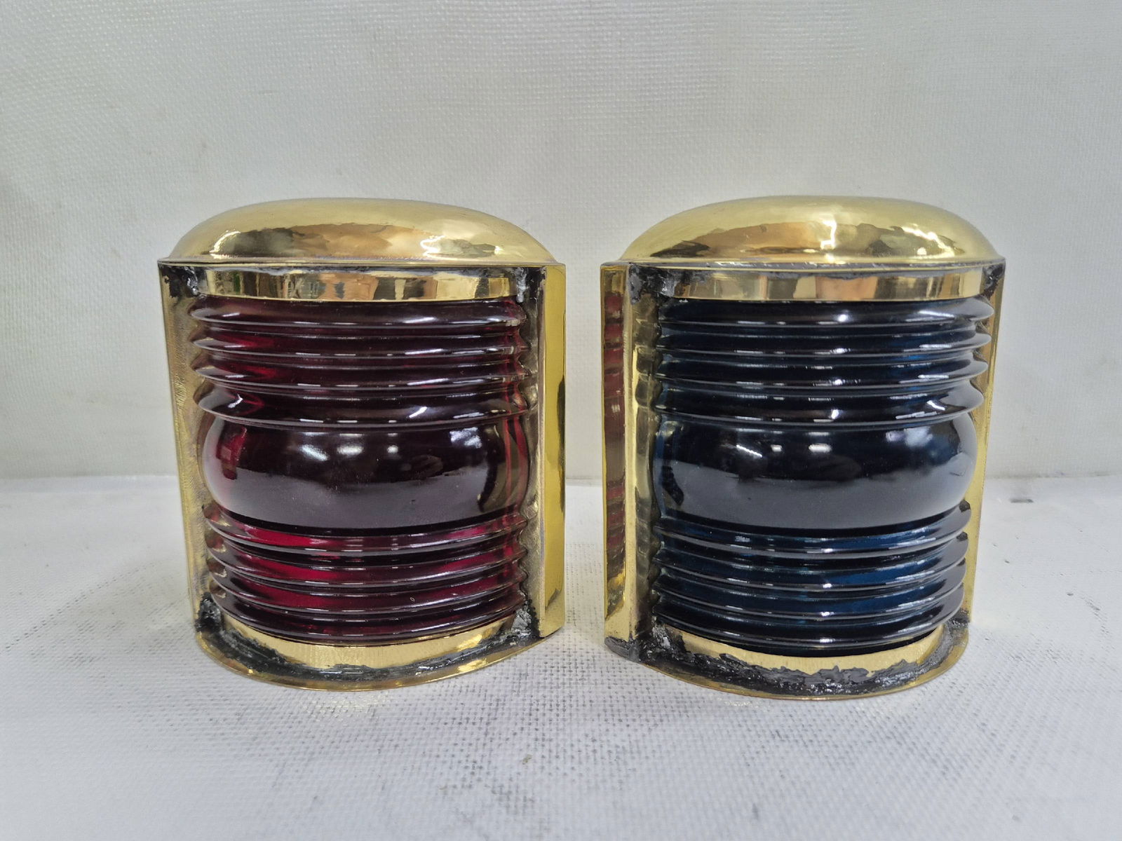 Small Pair of Port and Starboard Lanterns for a Small Boat: Pair of solid brass small craft port and starboard lanterns. With Fresnel glass aqua blue and ruby red lenses. 4 lbs both. 5"H x 5"W x 4"D each.