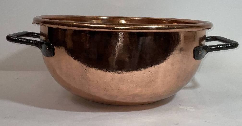 Large Polished Copper Cauldron with Iron Handles: Highly polished and lacquered copper cauldron. Amazing finish with wrought iron handles. Big with inch diameter bowl. 24 lbs. 10"H x 27"Diameter.