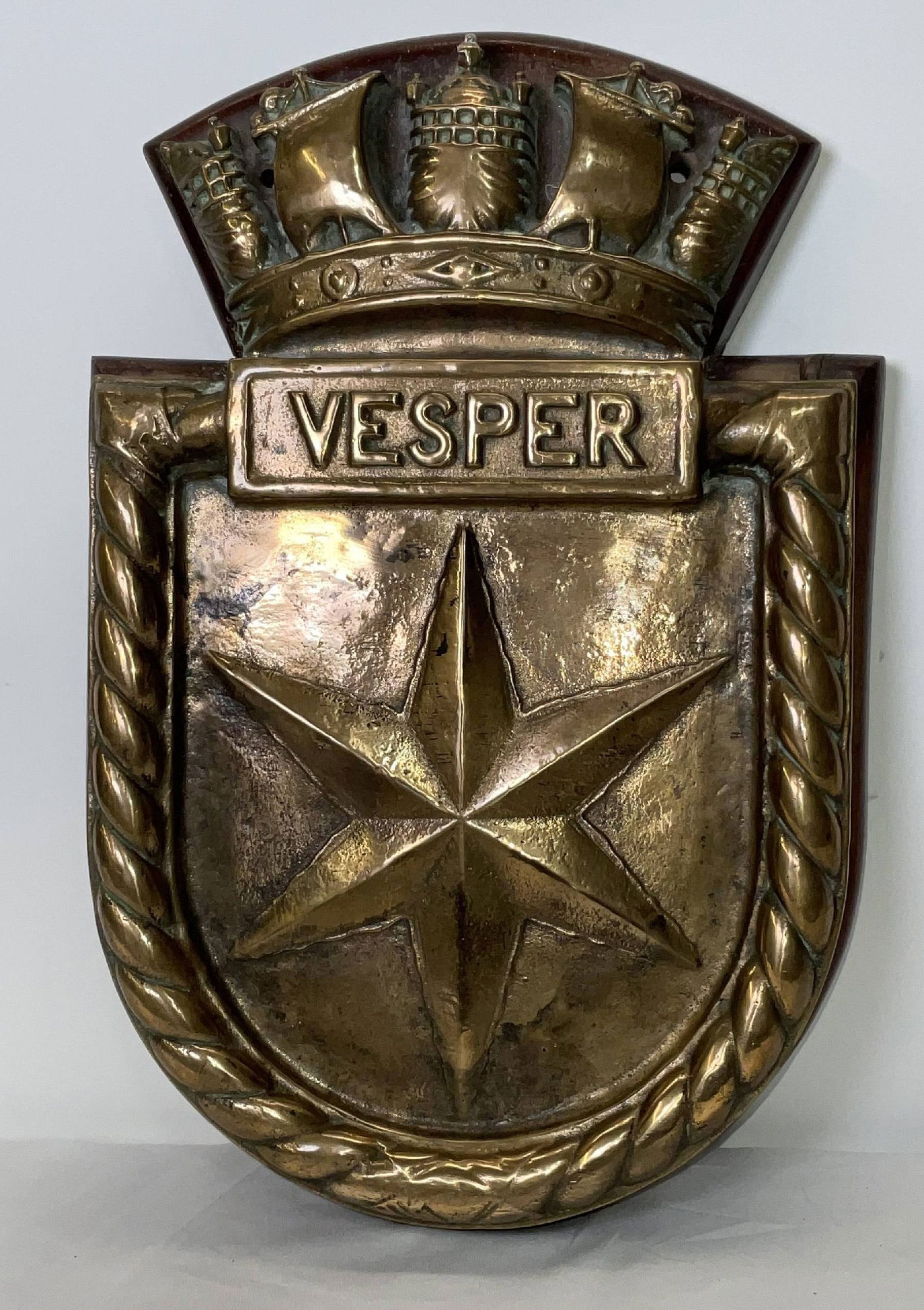 British Royal Navy Screen Badge from HMS Vesper: Classic warship screen badge from HMS Vesper. With large star design with rope border. Chatham pattern. HMS Vesper (D55) was a destroyer of the British Royal Navy, an Admiralty V and W-class