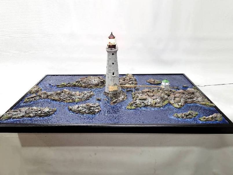 Graves Lighthouse Diorama of Boston: Incredible nautical diorama showing "GRAVES LIGHT" near Boston Harbor. Graves light was built in 1905, eight miles off the coast off of Boston. Diorama shows ledges, lighthouse tower, decks, and oil h
