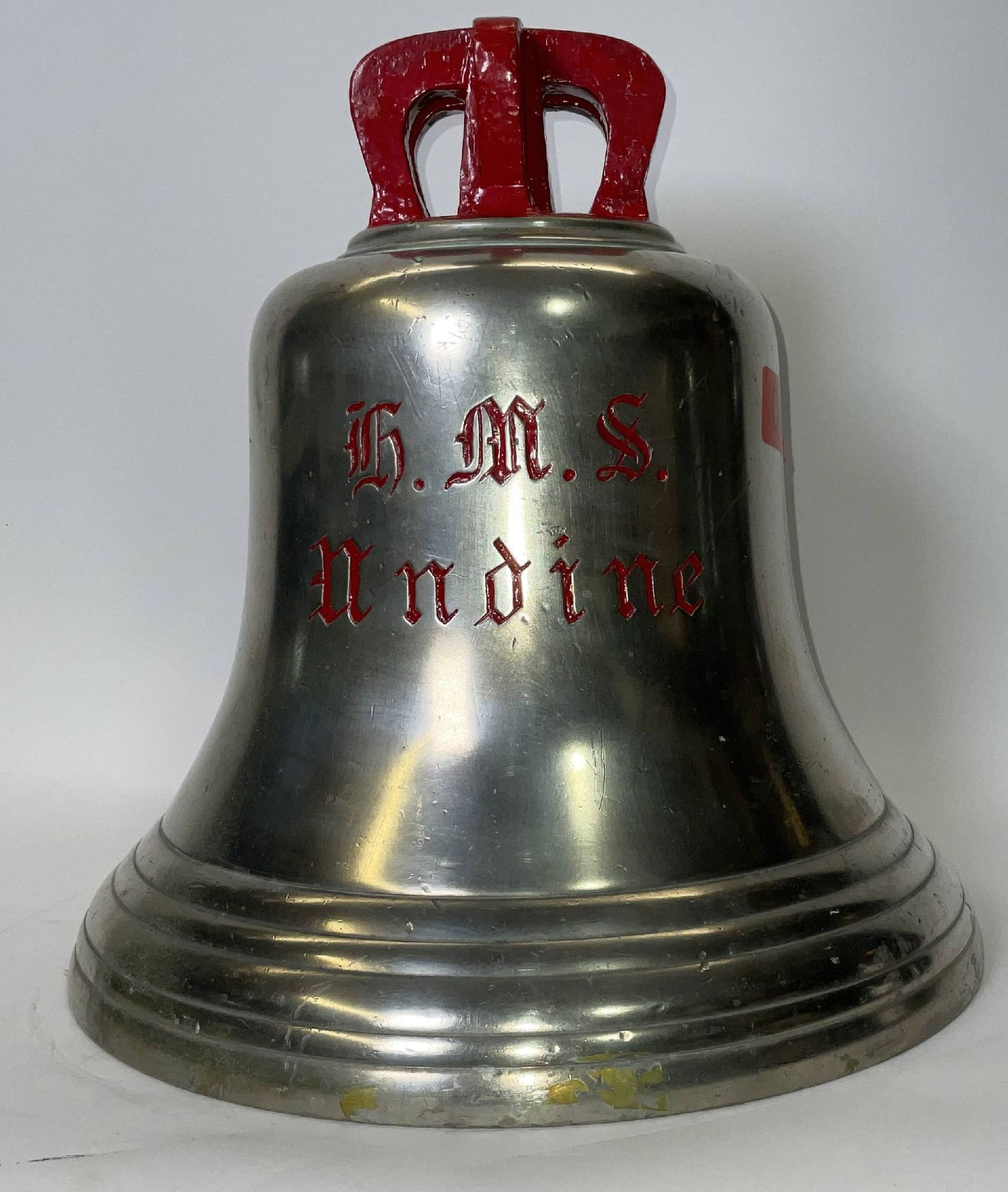 Bell from H.M.S. Undine: Solid brass bell from the ship H.M.S. Undine, engraved “H.M.S. Undine” fitted with a six canon crown mount cast into the bell. H.M.S. Undine was a U-class submarine of the British Royal Navy,