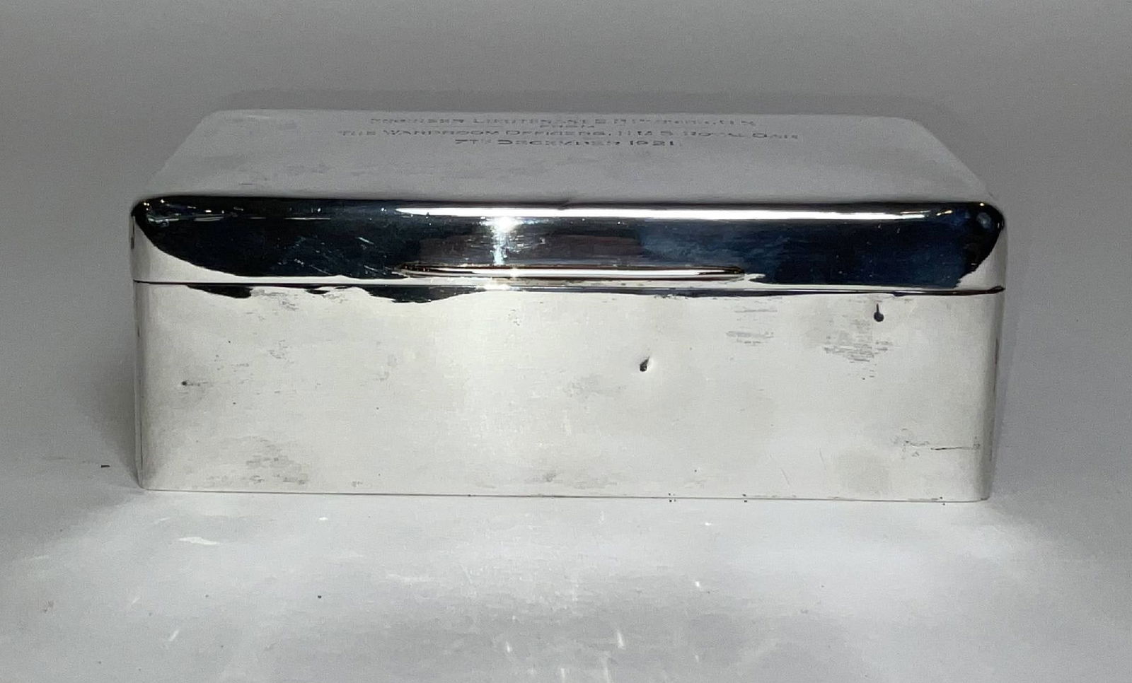 Silver Box with Royal Navy Ship H.M.S. Royal Oak Provenance: Sterling presentation box presented "To Engineer Lieutenant E.P. Parrick, R.N., from the wardroom officers, HMS Royal Oak, 7th December 1921," with sterling lion hallmark. Hinged lid. Wood lined inter