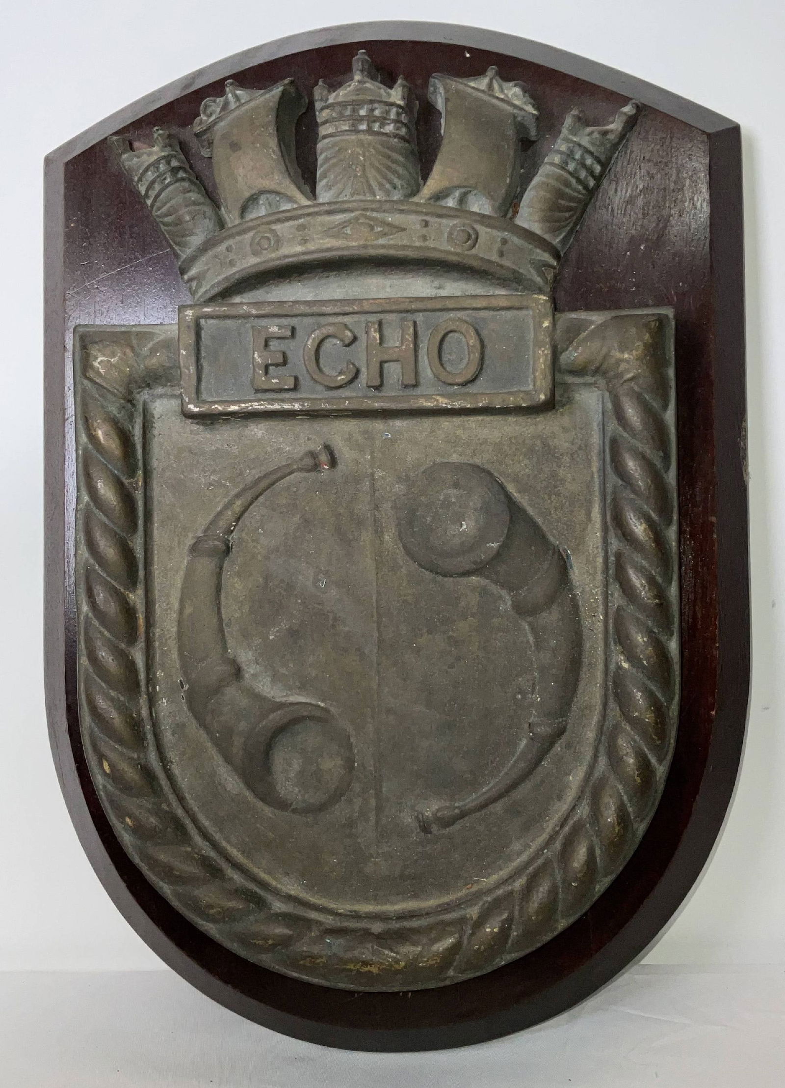 Ship's Wheelhouse Badge from HMS Echo H23: Large ship's badge from the wheelhouse of "HMS Echo" of the British Royal Navy. HMS Echo, launched in 1943, was an E-class destroyer that saw service in the Atlantic, Arctic, and Mediterranean