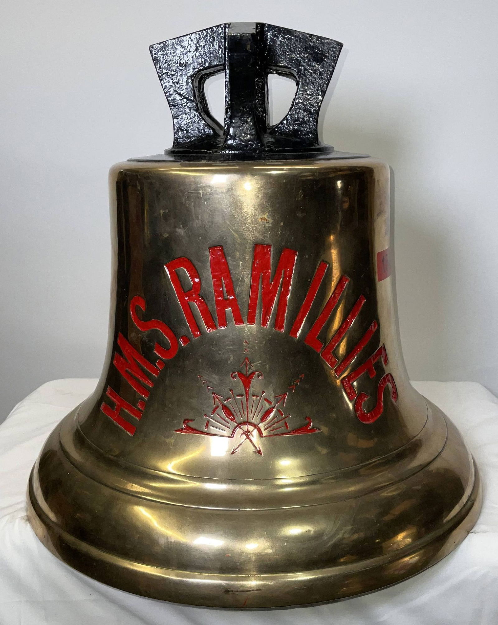 Bell from H.M.S. Ramillies: Solid brass bell from the ship H.M.S. Ramillies, engraved “H.M.S. Ramillies” fitted with a six canon crown mount cast into the bell. H.M.S. Ramillies was a Revenge-class battleship of the