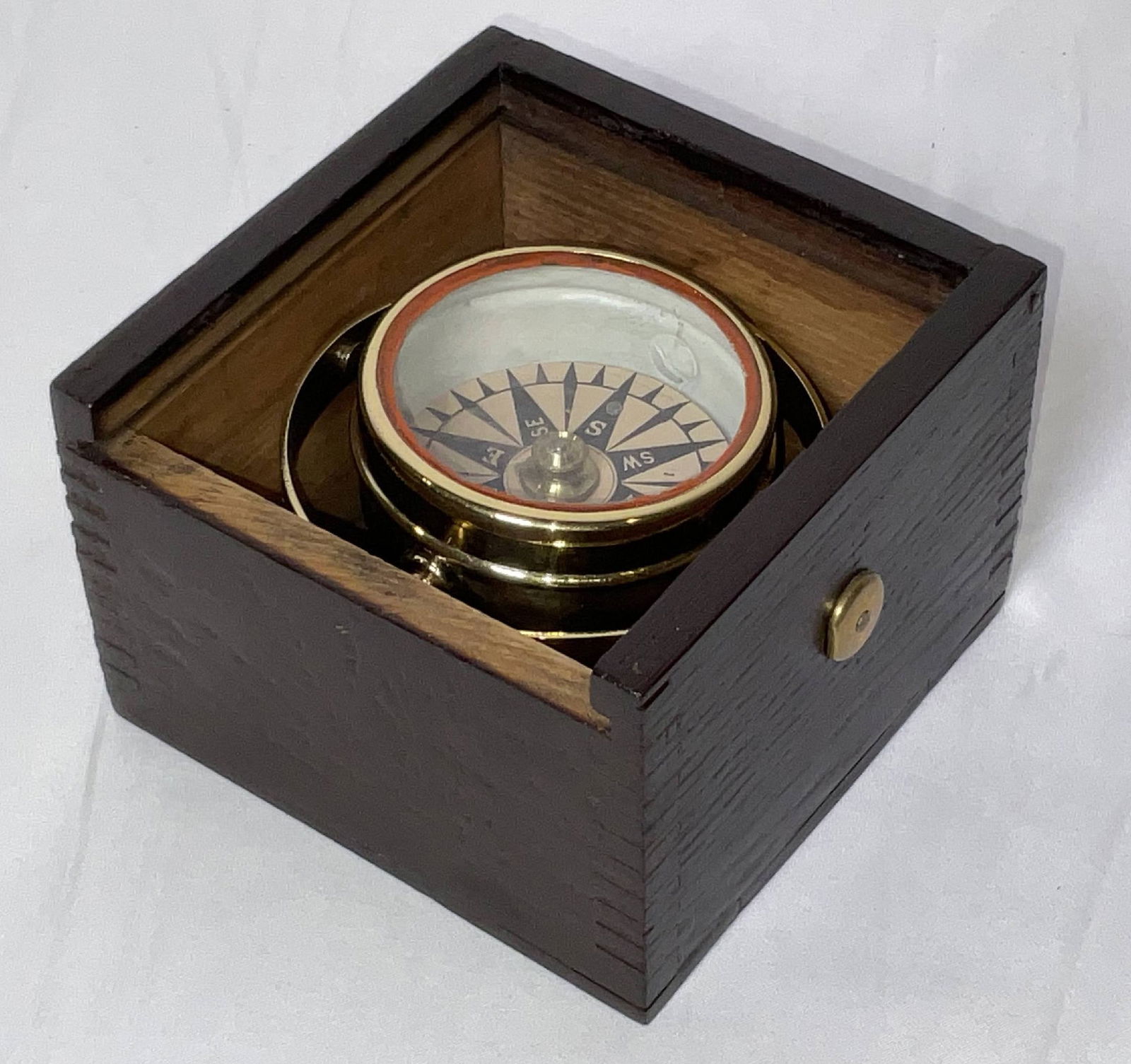 Mid 19th Century Small Boat Compass in Box: Fine small highly polished small boat compass with lacquer. Dry card with brass bowl that is fitted to a varnished box with sliding lid. Great little relic. 2 lbs. 4"H x 5"W x 5"D.