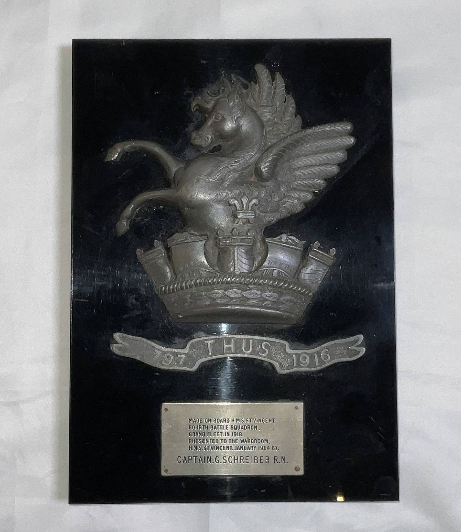British Royal Navy Ship's Crest for HMS Vincent: Ship's crest for HMS Vincent, given to the ship's wardroom in 1964, with a Pegasus horse rising from a Royal crown. Mounted to a wood plaque. 3 lbs. 10"H x 7"W.