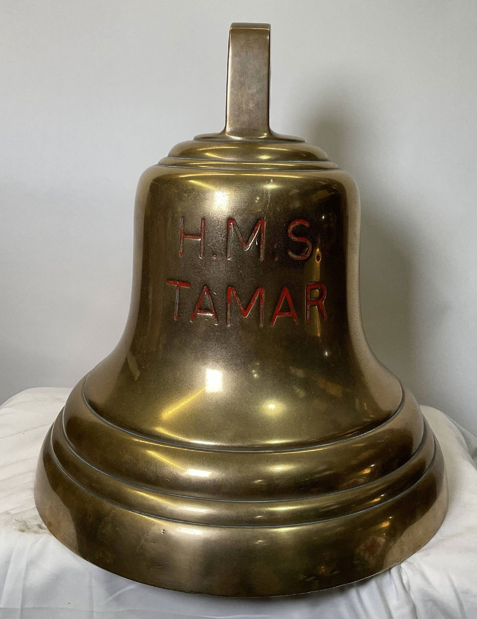 Bell from H.M.S. Tamar: Solid brass ship’s bell from H.M.S. Tamar, engraved “H.M.S. Tamar.” HMS Tamar was a 28-gun wooden screw frigate of the British Royal Navy, launched in 1863. She served extensively on