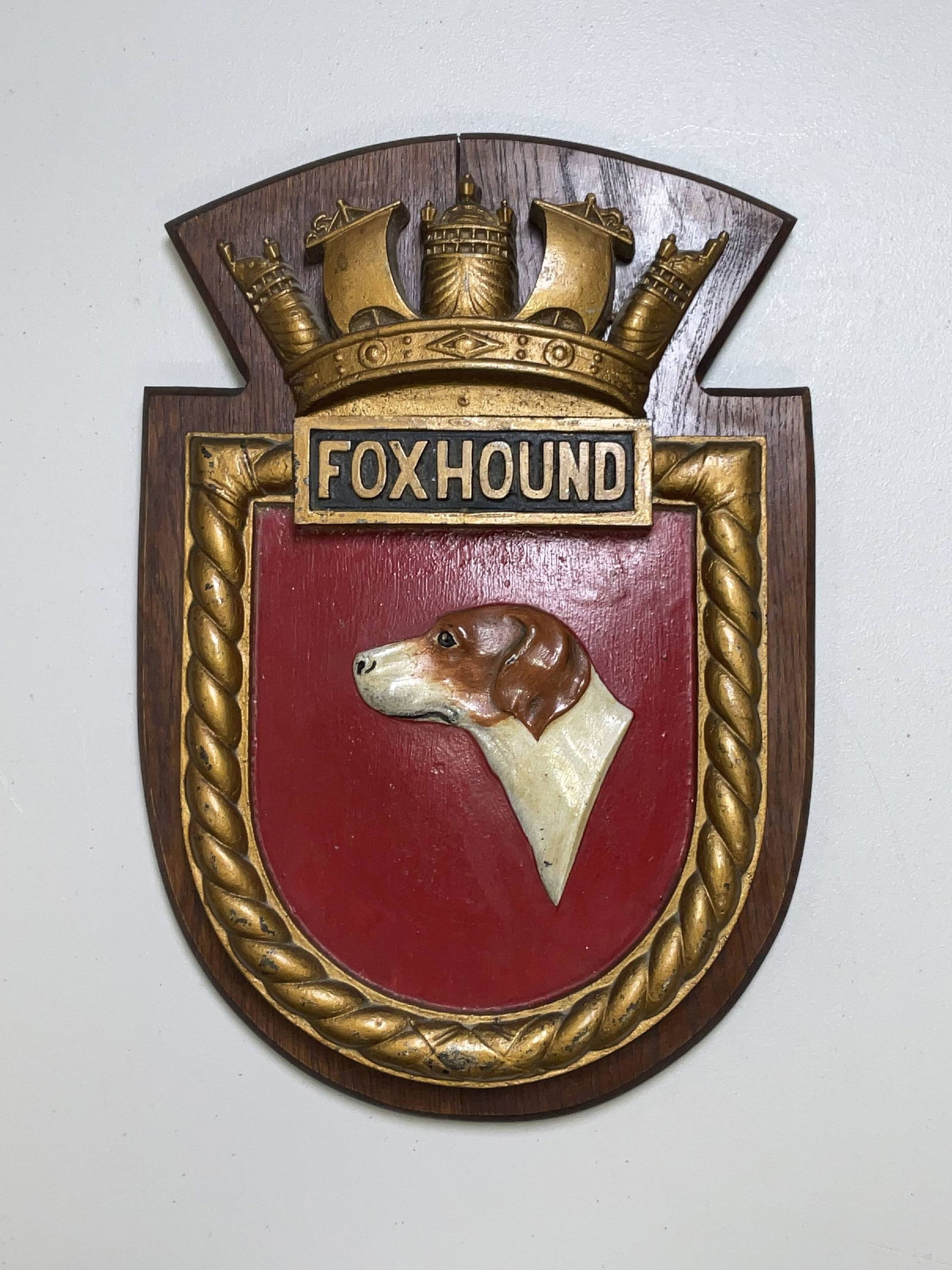 Screen Badge from British Royal Navy Warship HMS Foxhound: British Royal Navy warship screen badge from HMS Foxhound, an F-class destroyer, built by John Brown Shipbuilding & Engineering. HMS Foxhound assisted in sinking the German V-boat V-39. 19 lbs. 17"H