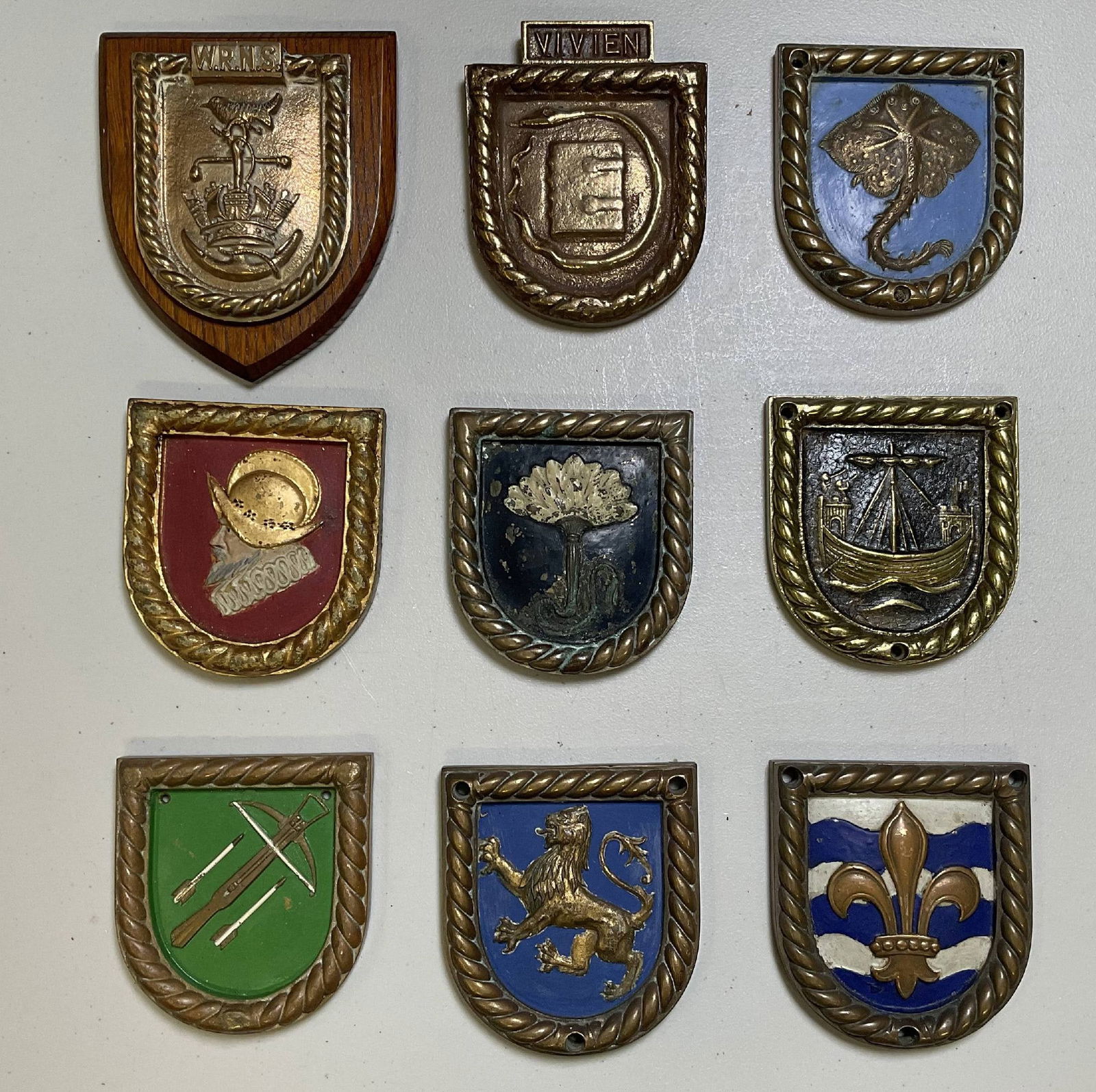 Nine Shield Shaped Royal Navy Warship Badges: Quality group of Royal Navy badges from the Womens Royal Navy Service (Wrens), the destroyer HMS Vivien, HMS Skate, which served in WWI and WWII and rescued 55 survivors from British tanker Torinia,