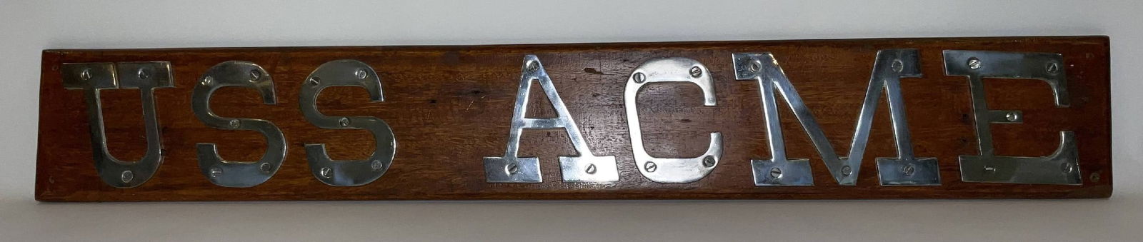 United States Navy Ship’s Nameboard USS Acme: Ship’s nameboard from the United States Navy cargo ship USS Acme (AK-101), an Acme-class cargo vessel commissioned in 1943 during the Second World War. USS Acme served with the Naval Transportation