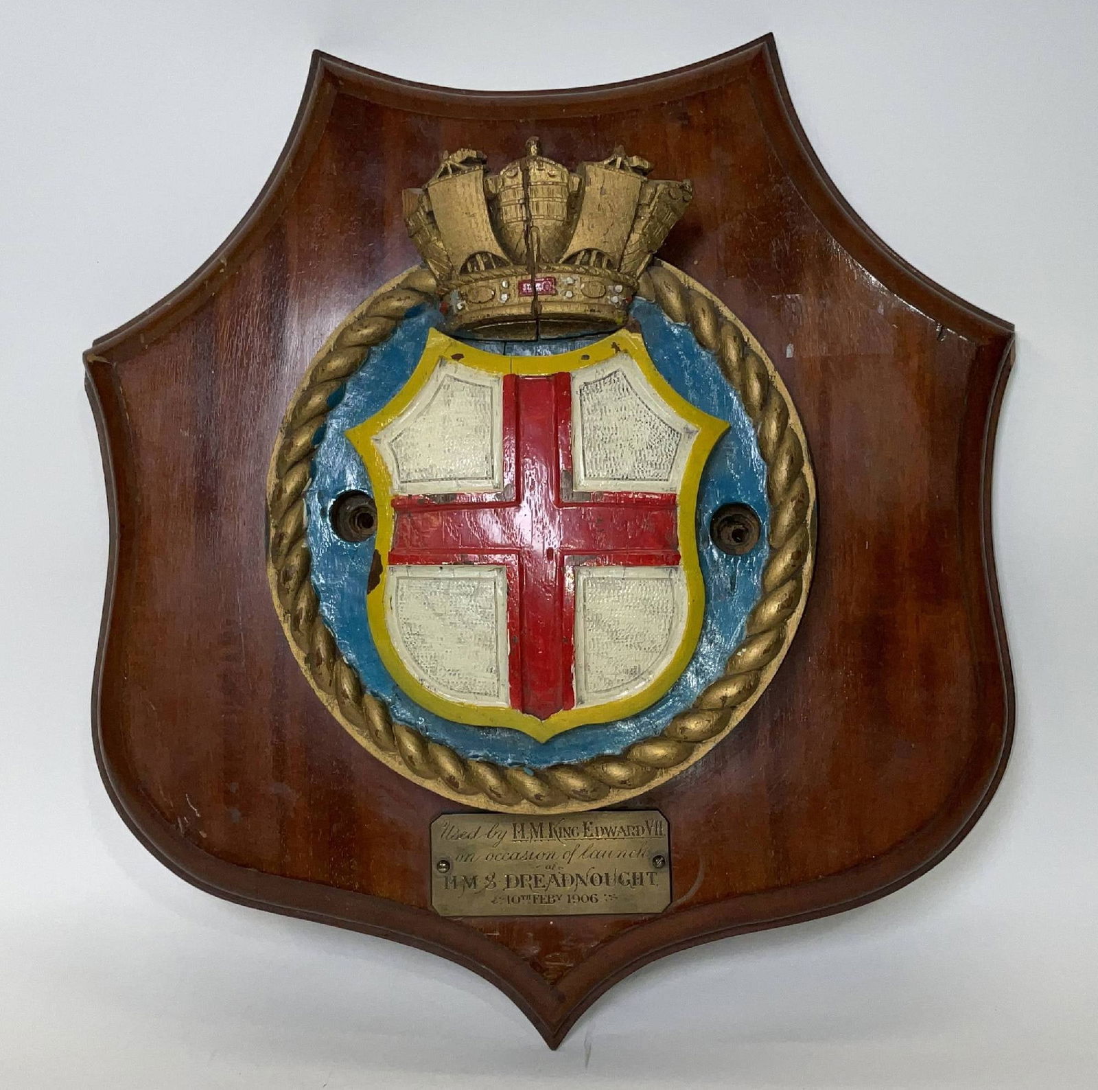 Ships Badge Wood Carving from HMS Dreadnought 1906: Period wood carving from HMS Dreadnought’s launching with engraved brass plate that reads “Used by King Edward VII” on the occasion of the launch of HMS Dreadnought, 10th February 1906. HMS