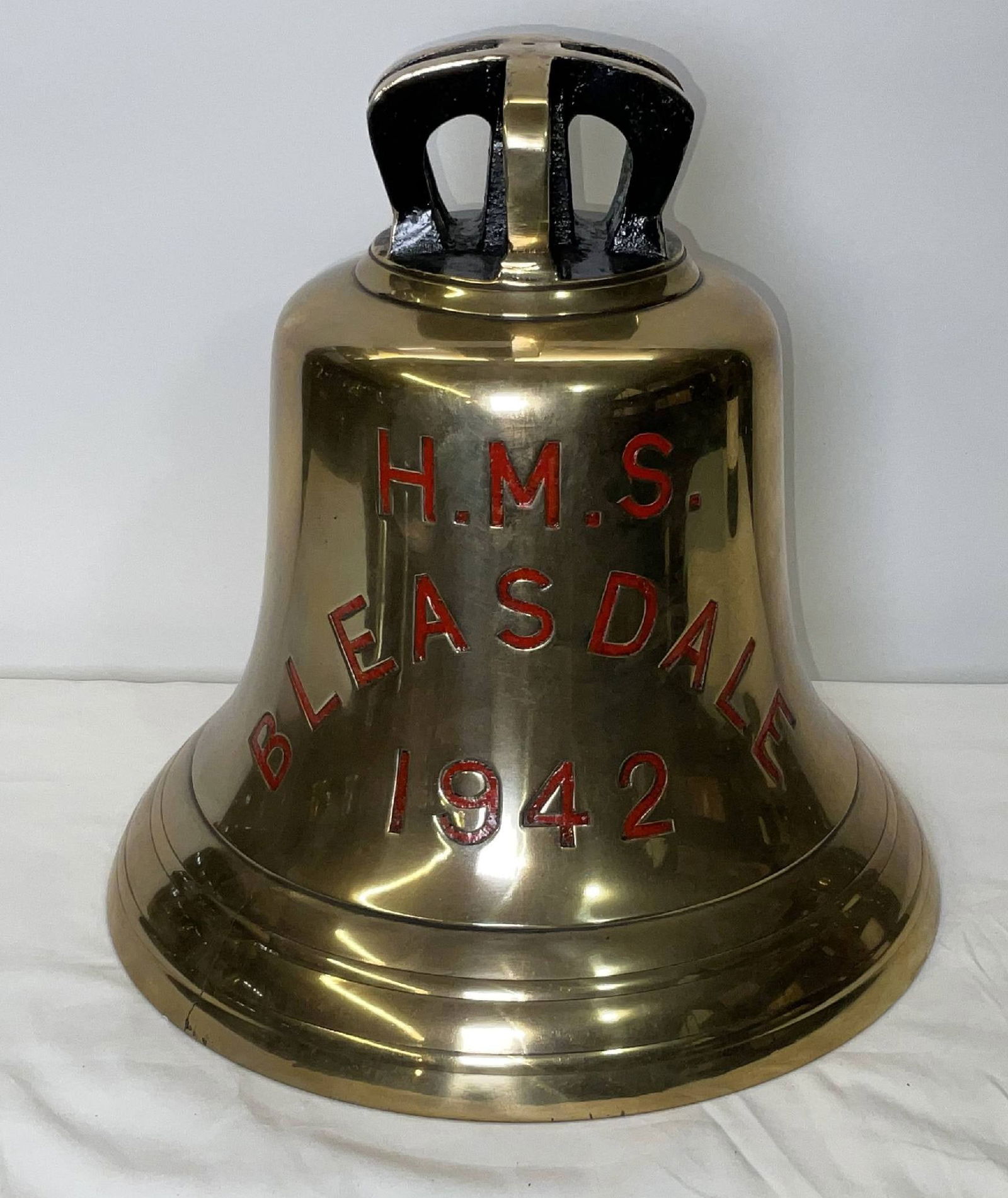 Bell from H.M.S. Bleasdale, 1942: Solid brass bell from the ship H.M.S. Bleasdale, engraved “H.M.S. BLEASDALE 1942” fitted with a six canon crown mount cast into the bell. H.M.S. Bleasdale was a Type II Hunt-class escort destr