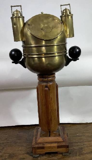 Early 20th Century Ship's Binnacle: Ship's binnacle on wood pedestal. The binnacle itself is a brass bowl with top that holds 2 oil lamps with porcelain burners. Iron compensating balls are mounted to brass brackets. The wood pedestal