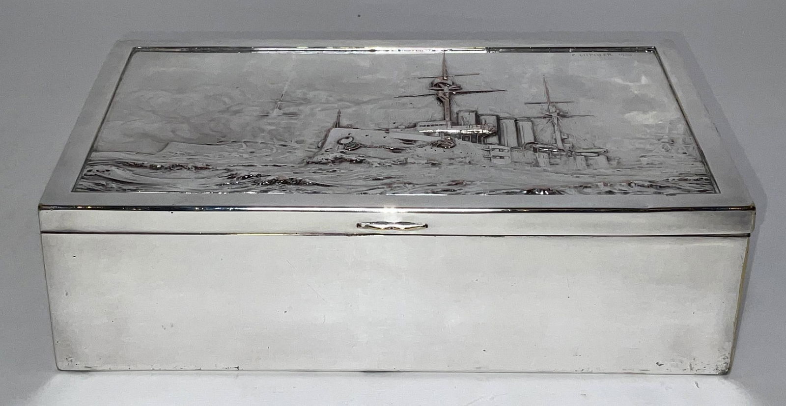 Silver Plated Box with HMS Leviathan in Repoussé: Silver plated box with HMS Leviathan in repoussé on the lid. Signed F. Lutiger 1909 on the top right corner. Wood lined. Highly detailed with three cruisers in heavy seas. 4"H x 9"W x 6"D
