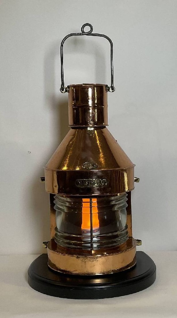 Ships Masthead Lanten of Solid Copper: Ships lantern with brass makers badge from Griffith and Sons, Birmingham England. This is a solid copper masthead lantern with fresnel glass lens. Highly polished and lacquered. Mounted to a thick