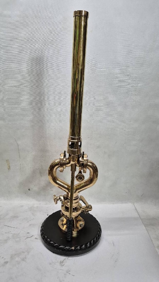 Ship's Water Register Made of Solid Brass: Polished and lacquered water cannon from a ship with swivel gears and control arm. Mounted to a wood base.