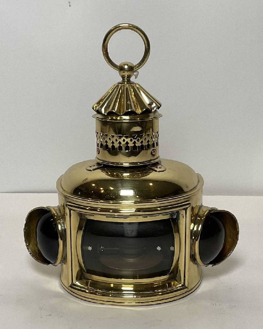 Antique Brass Boat Lantern: Antique Bow Lantern from a boat by an English maker. Fitted with clear, red, and blue lenses. The red and blue are thick Convex Bullseye design, the clear is convex. Vented chimney with carry ring. Ci