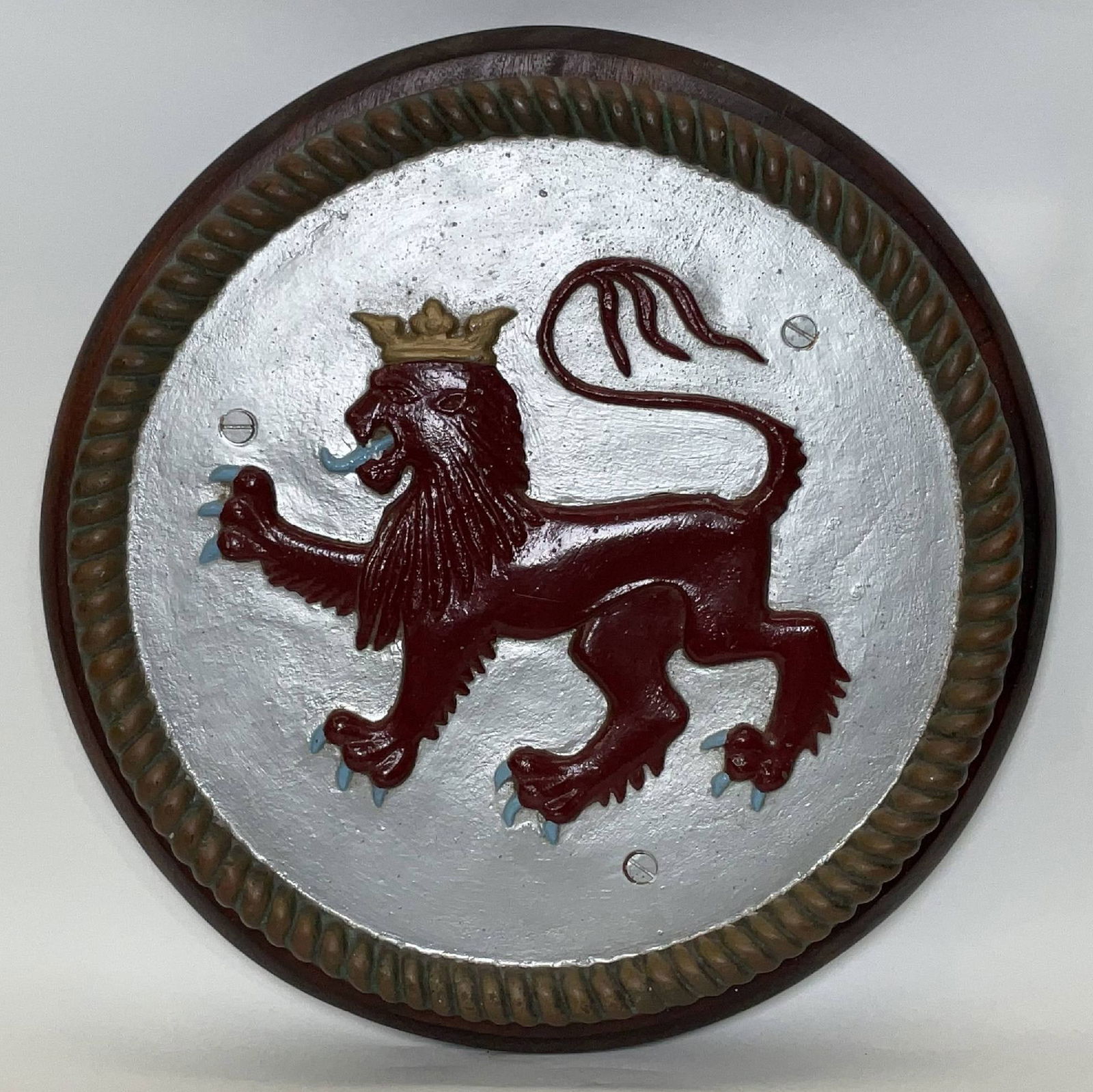 HMS Devonshire Gun Tompion of a Lion with Crown: Heavy fifty-pound gun tompion from HMS Devonshire, a County-class heavy cruiser of 633 feet. HMS Devonshire served in both World Wars and saw action. The tompion shows a lion with long mane and Royal