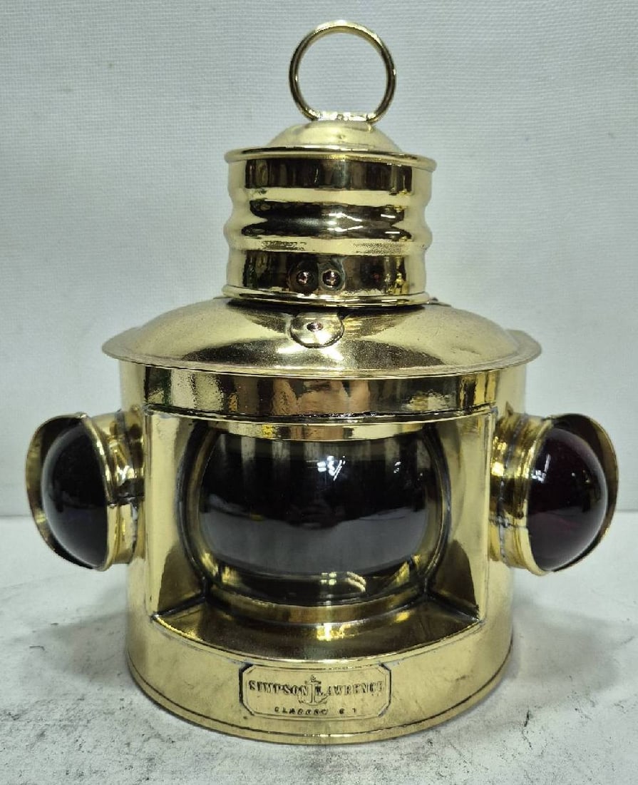 Solid Brass Boat Lantern by Perkins Marine Corporation: Highly polished and lacquered boat lantern with orange, red, and green Fresnel lenses on hinged doors, with vented turret top and carry ring. The back of the lantern is stamped Perkins Marine Lamp Cor