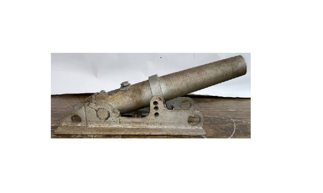 Early 20th Century Line Throwing Gun: Line throwing gun with maker's badge, barrel, and carriage. Entire unit is iron, not bronze. Front level adjusting bar is present. Overall length: 33" H x 12" W x 15" T.