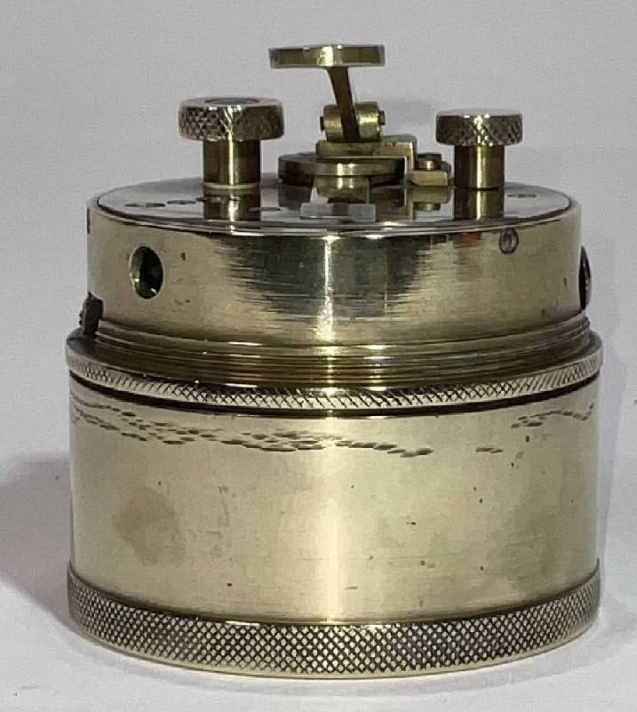 Pocket Drum Sextant from the Early Twentieth Century: Solid brass drum sextant with pinhole viewer, mirrors, magnifying glass, adjustment knobs, and more. The number 5048 is engraved into the case. 3"H x 3"Diameter.